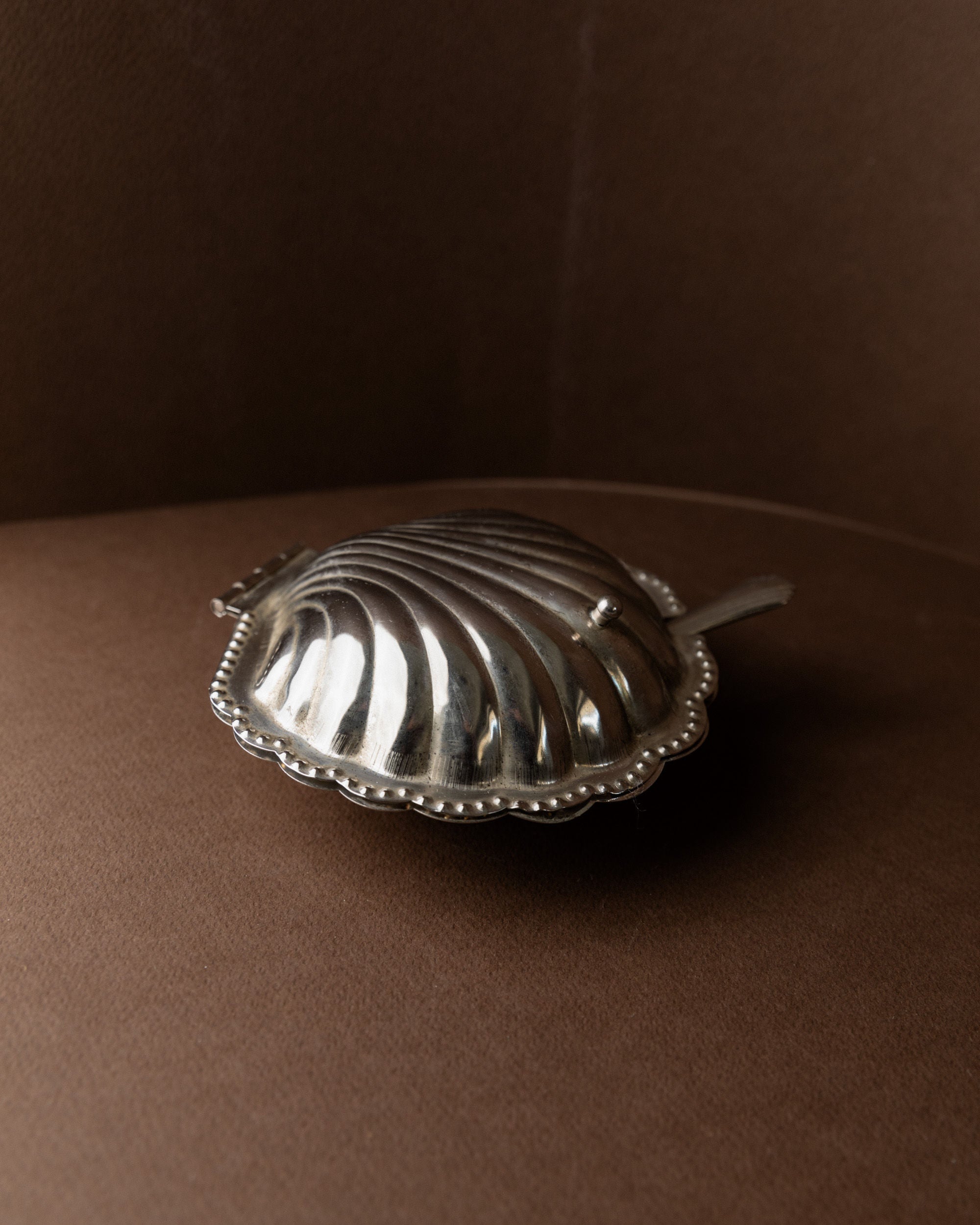 Shell-Shaped Sugar Bowl, Italy 1960s — side view on brown leather background
