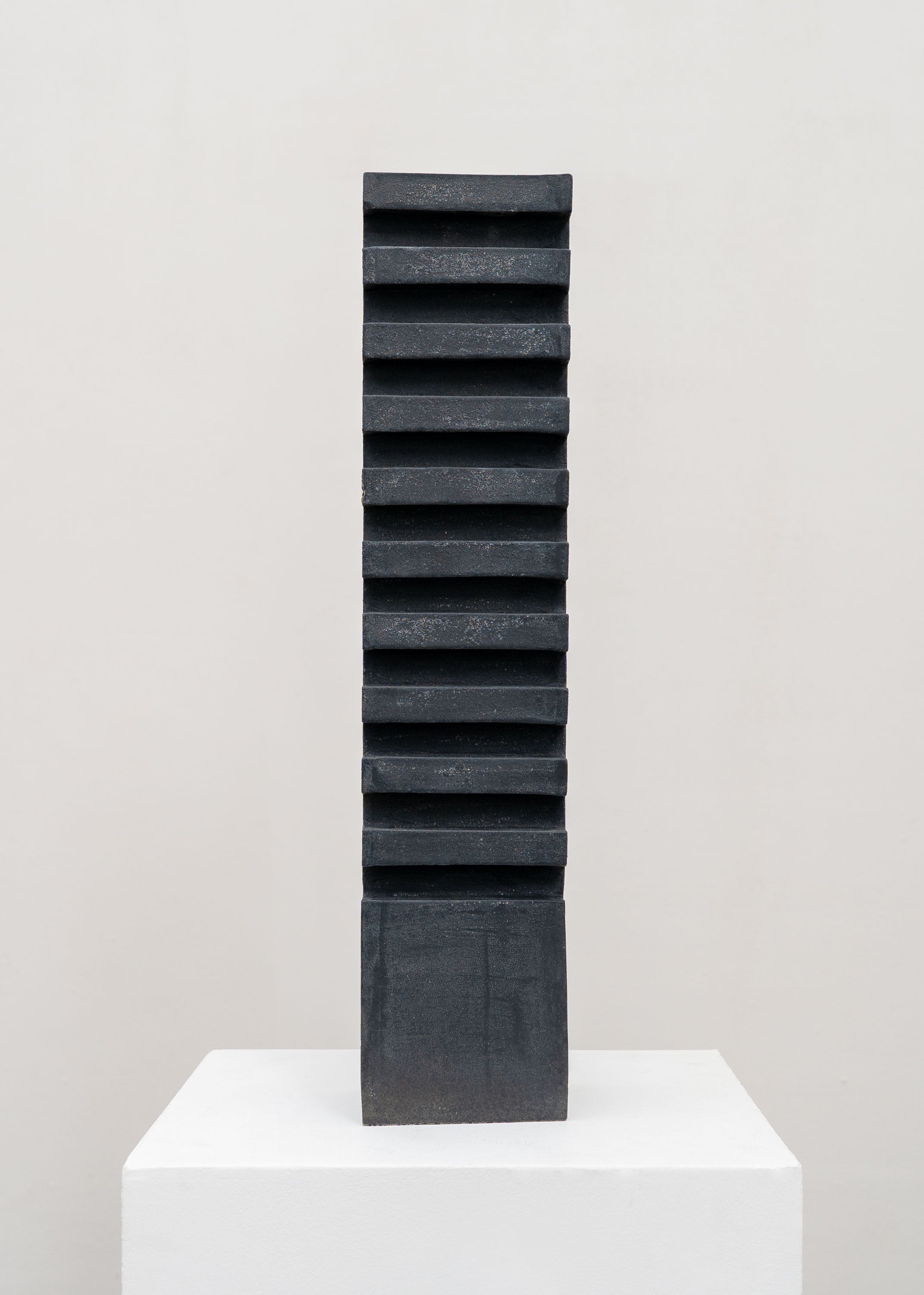 Tall Sculptural Stoneware Vessel by Tom Roberts — side angle showing textured black surface