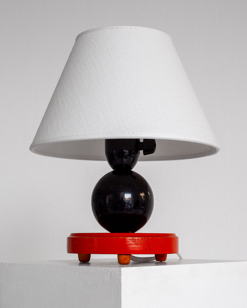Petite Wooden Art Deco Table Lamp — close-up of black globe base