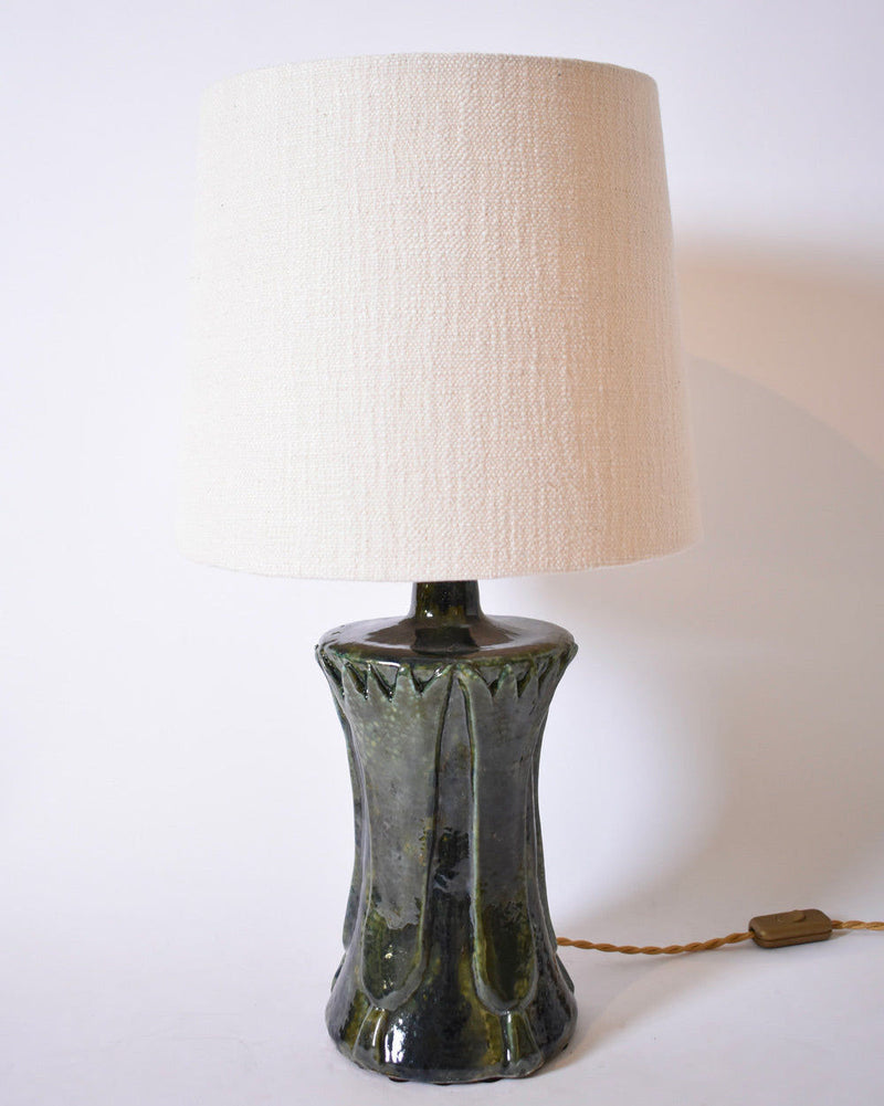The "Kasaï" Blue Green Papyrus Ceramic Lamp by Barracuda Interiors features a glossy blue green ceramic base, a textured cream fabric shade, twisted brown cord, and switch, shown against a plain white background.