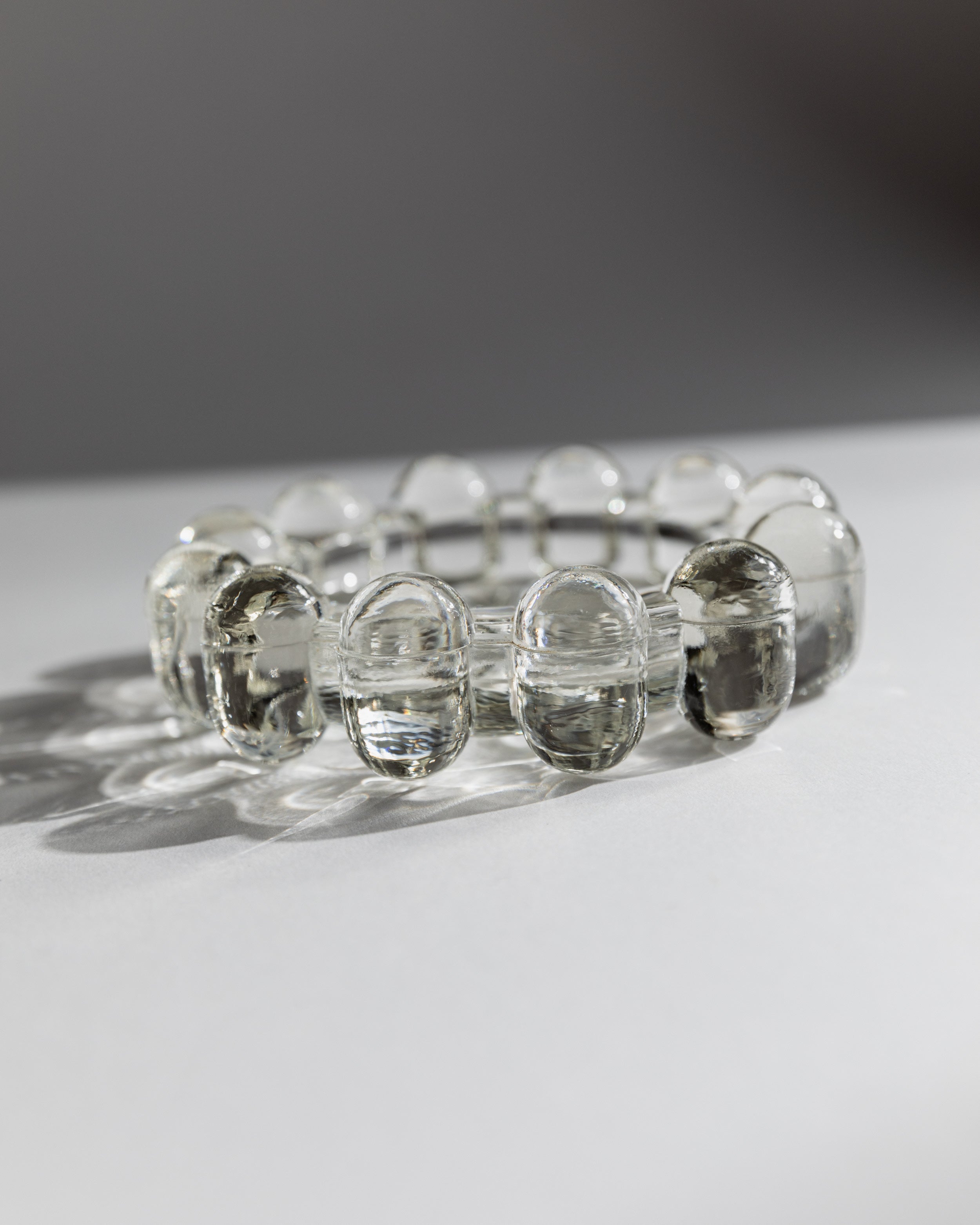 Clear glass ashtray with oval indentations, 1970s Italian design
