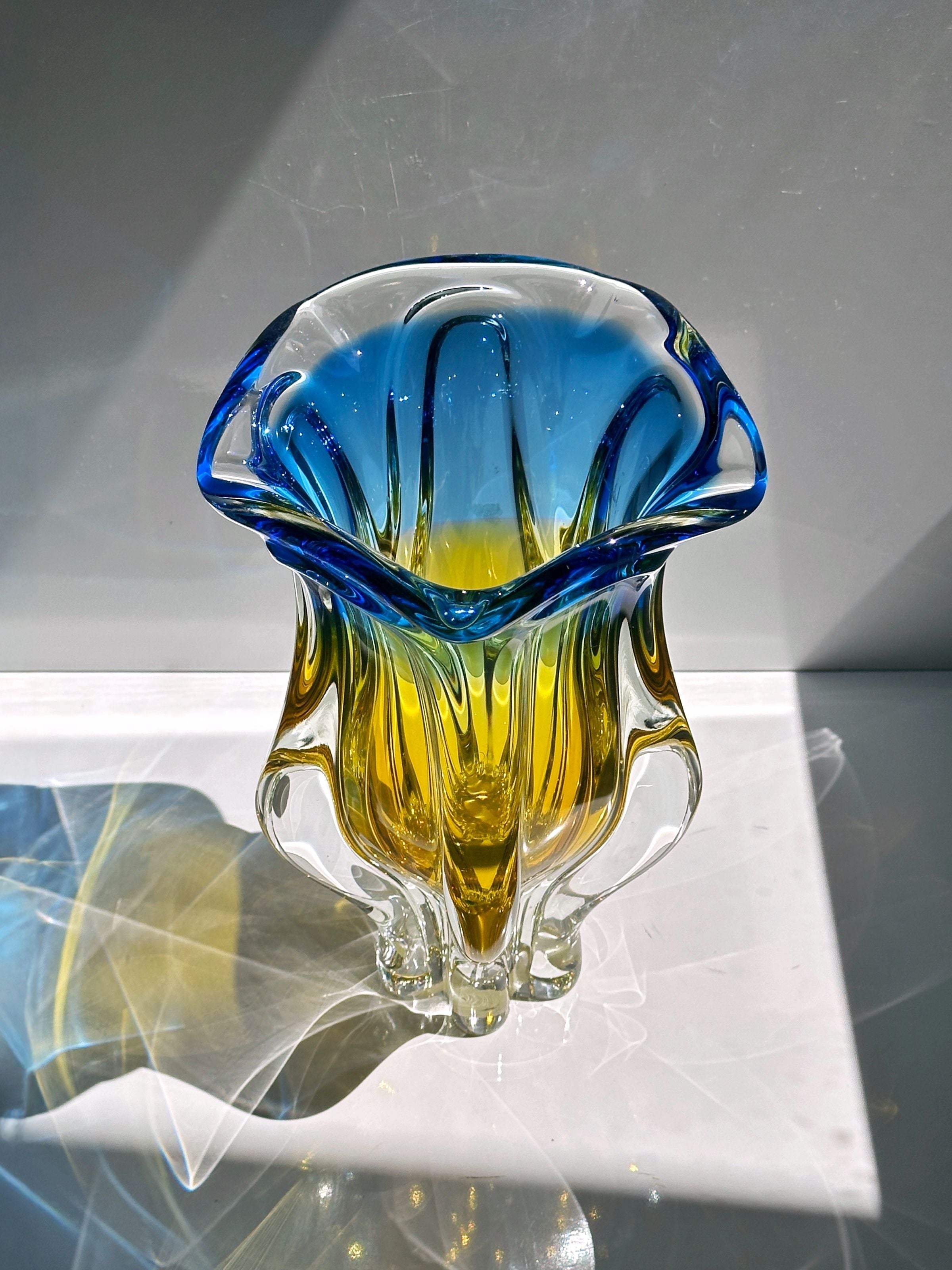 Blue and amber Bohemian glass vase detail showing color gradation