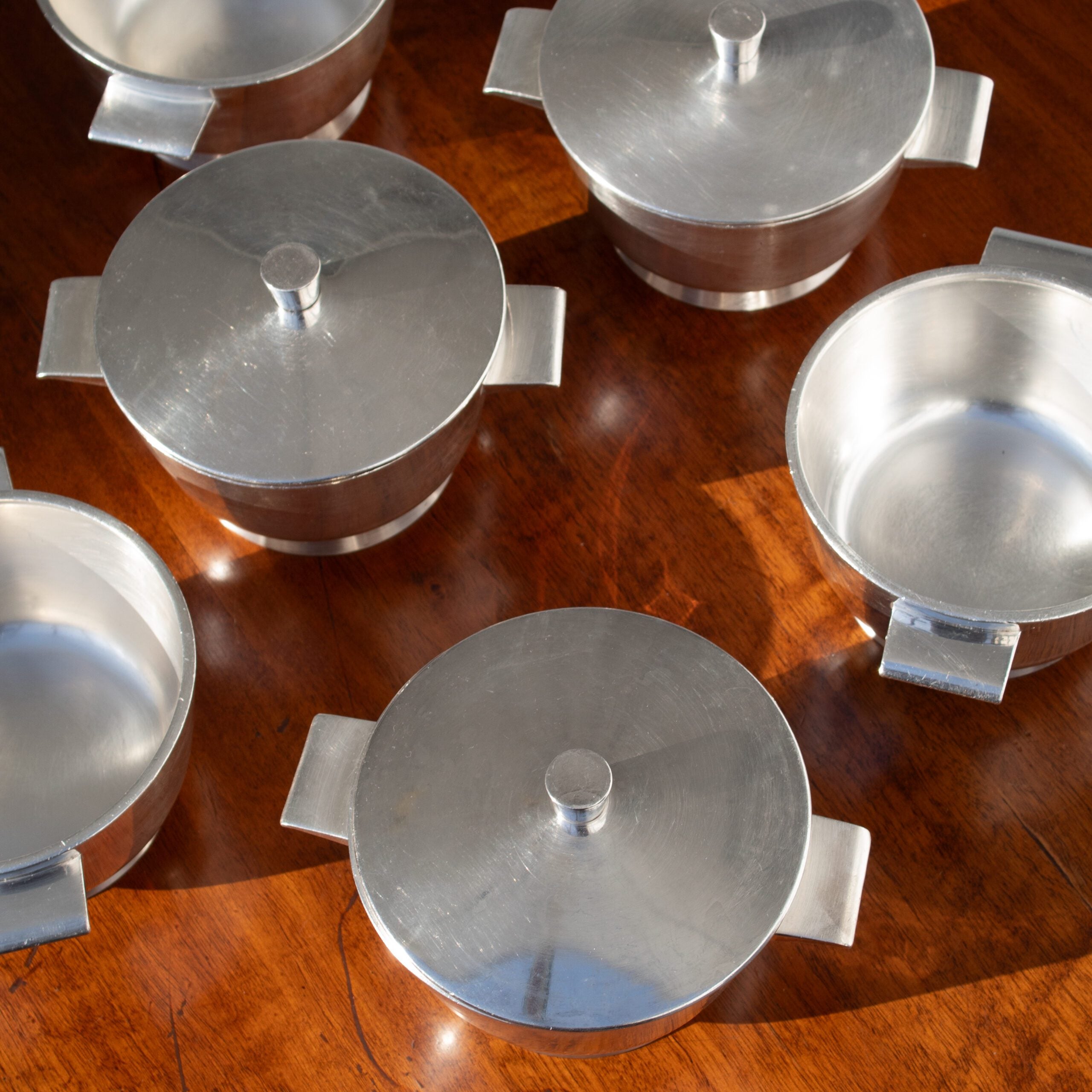 Arthur Krupp Milano Silver Plated Bowls Set — overhead view of silver bowls on wooden table