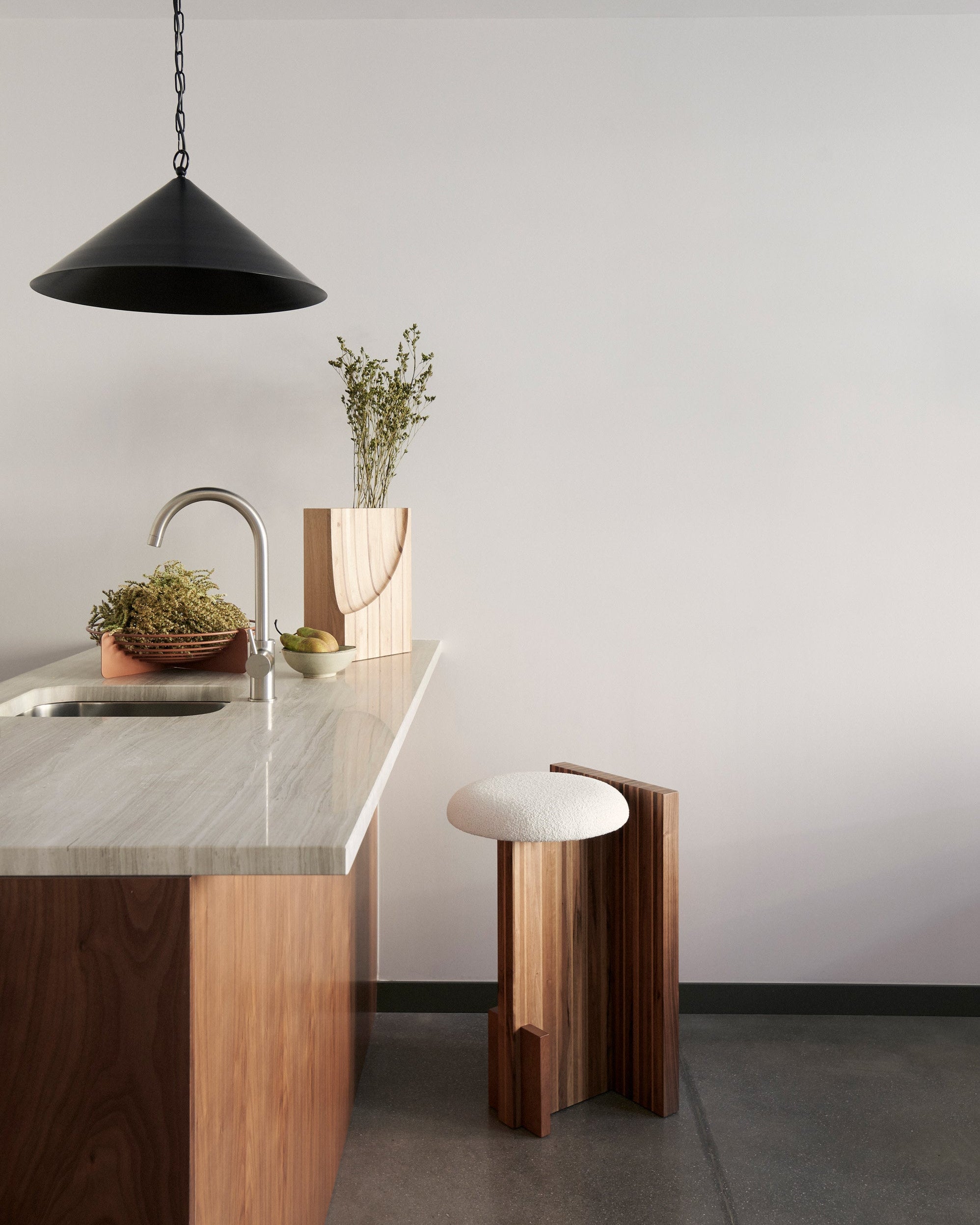 Arquivo Counter Stool — top view of white upholstered seat in kitchen