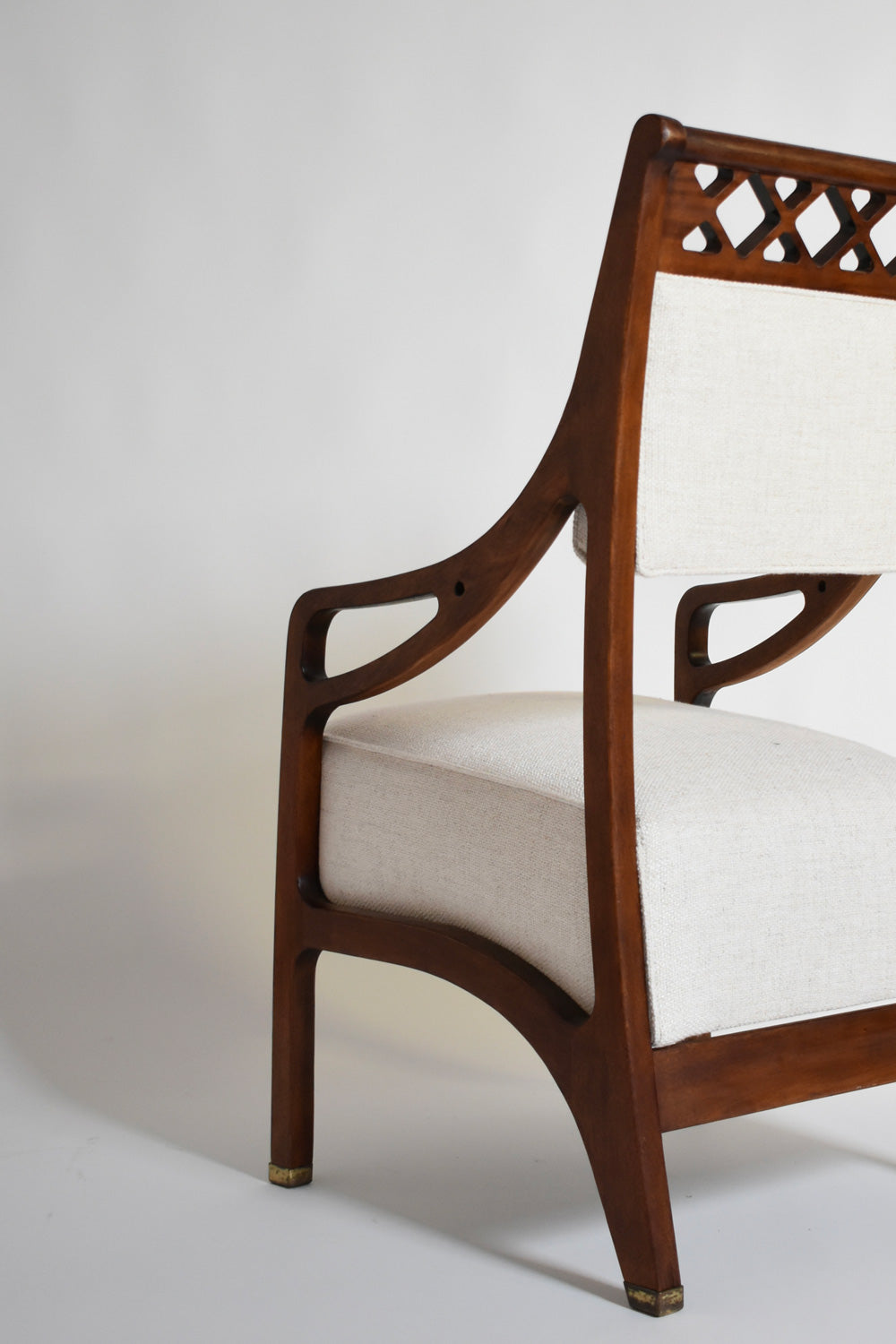 Pair of High Back Crosspieces Armchairs, 1960s — angled view highlighting wooden frame and fabric upholstery