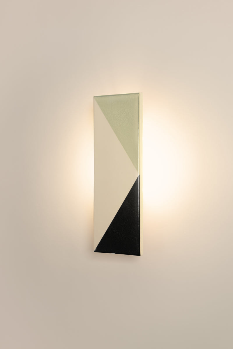 Tile VN — close-up of ceramic wall lamp in soft colors