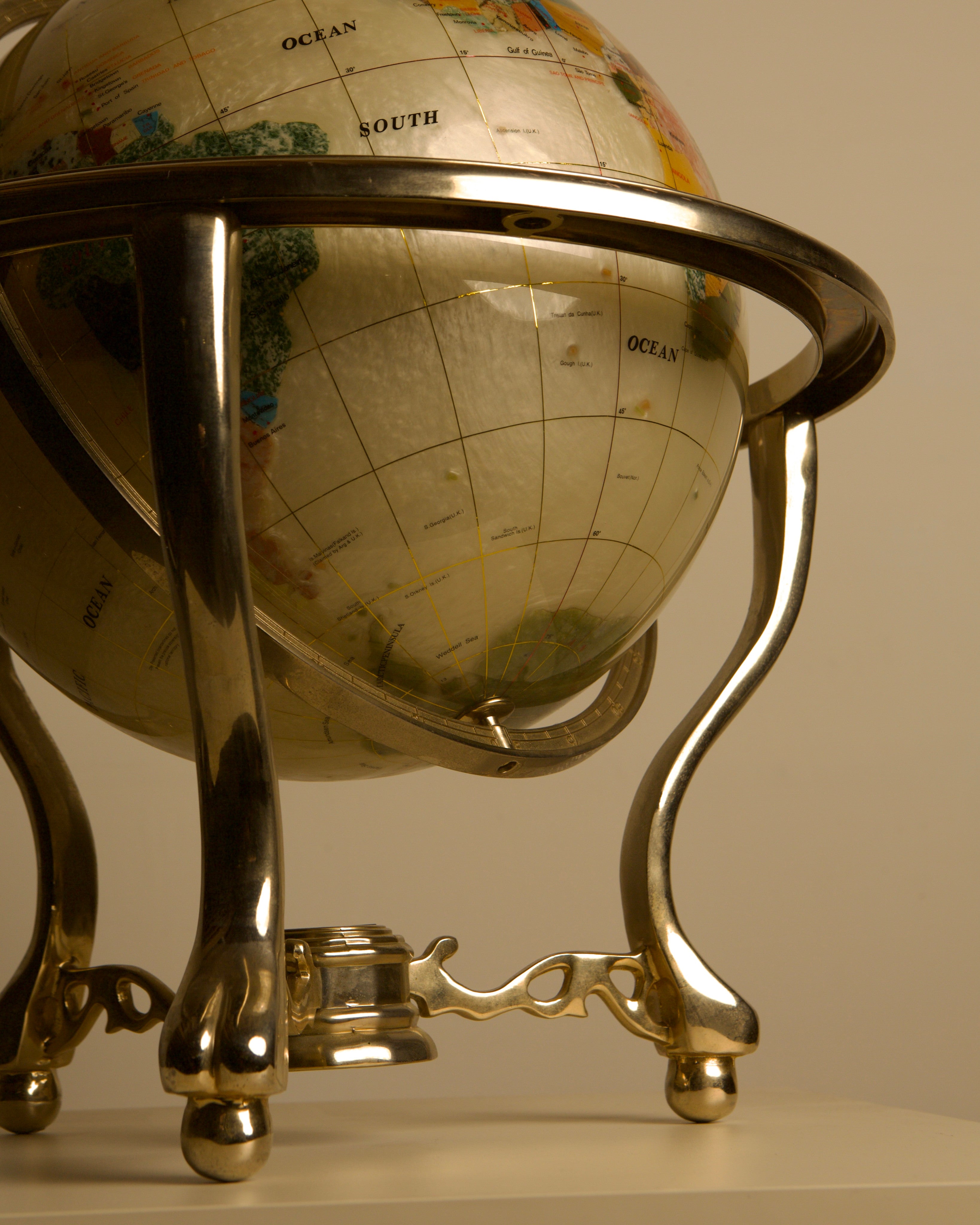 Large Globe Made of Hardstone and Mother-of-pearl, 1970s — angled view highlighting polished metal stand