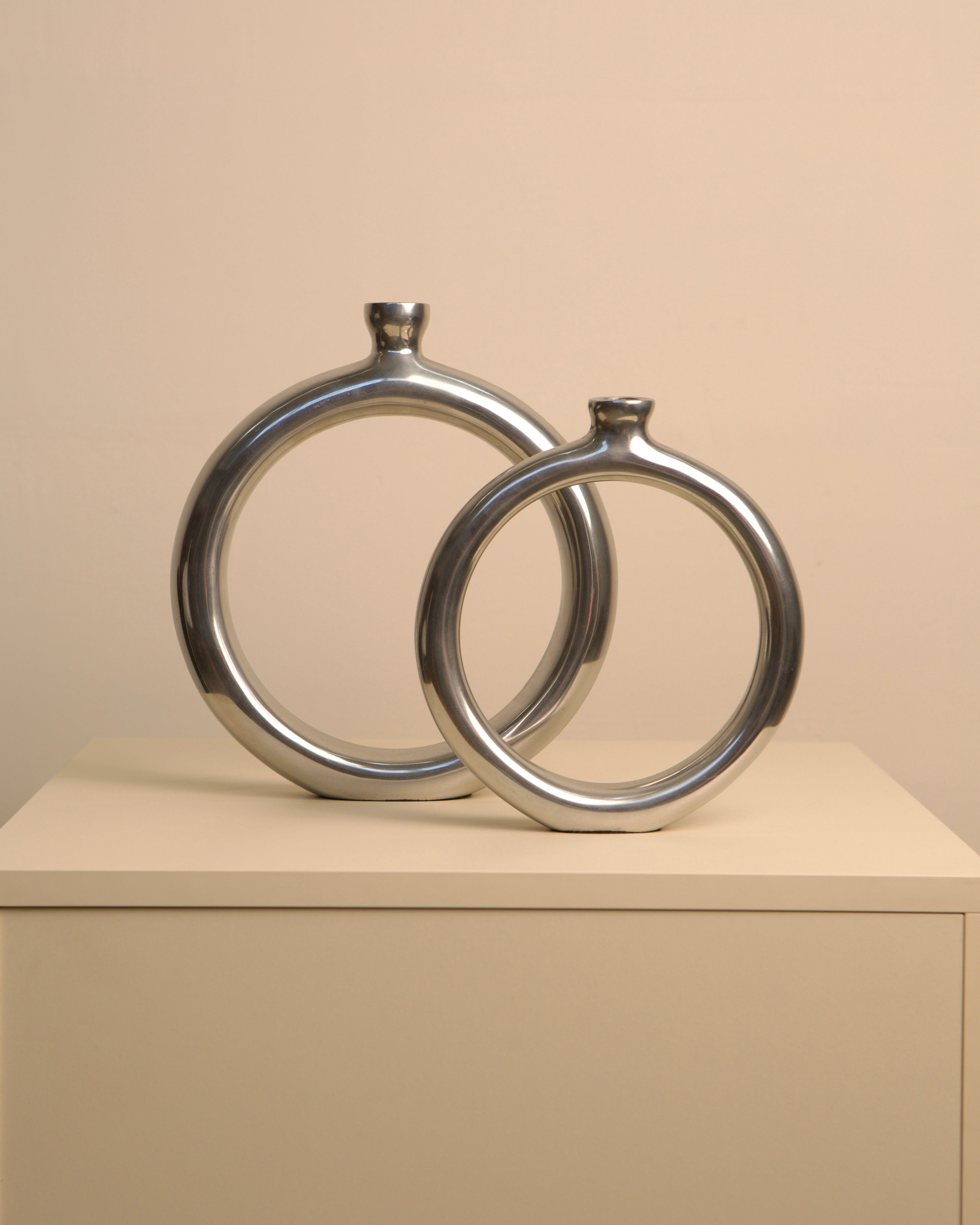 Pair of Italian aluminum circle vases from the 1980s
