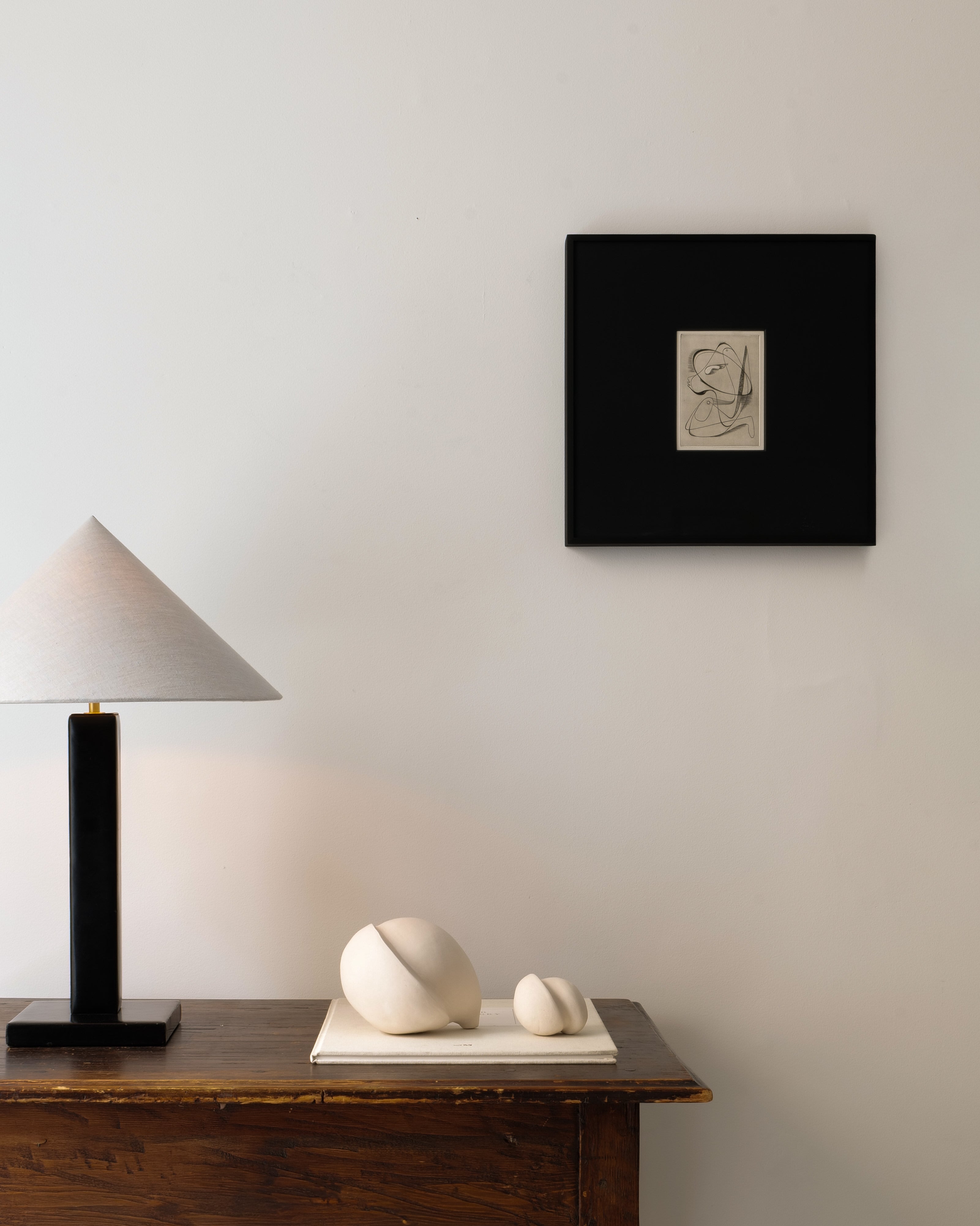 Surrealist Engraving Painting Sylvain Durand — displayed above wooden table with lamp