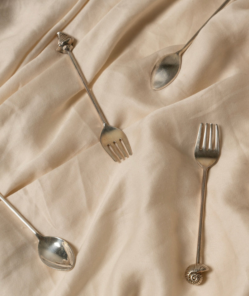 Silver Shell Fork Set of Two — close-up on silver forks with shell details