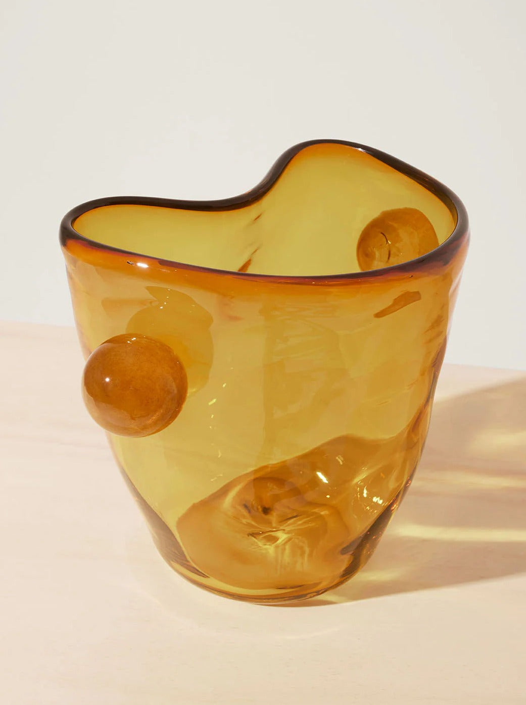 Mouthblown Oliver Vase — amber glass vase on light wooden surface