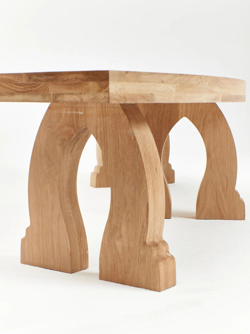 Sintra Curved Bench in Oak — close-up of curved wooden legs