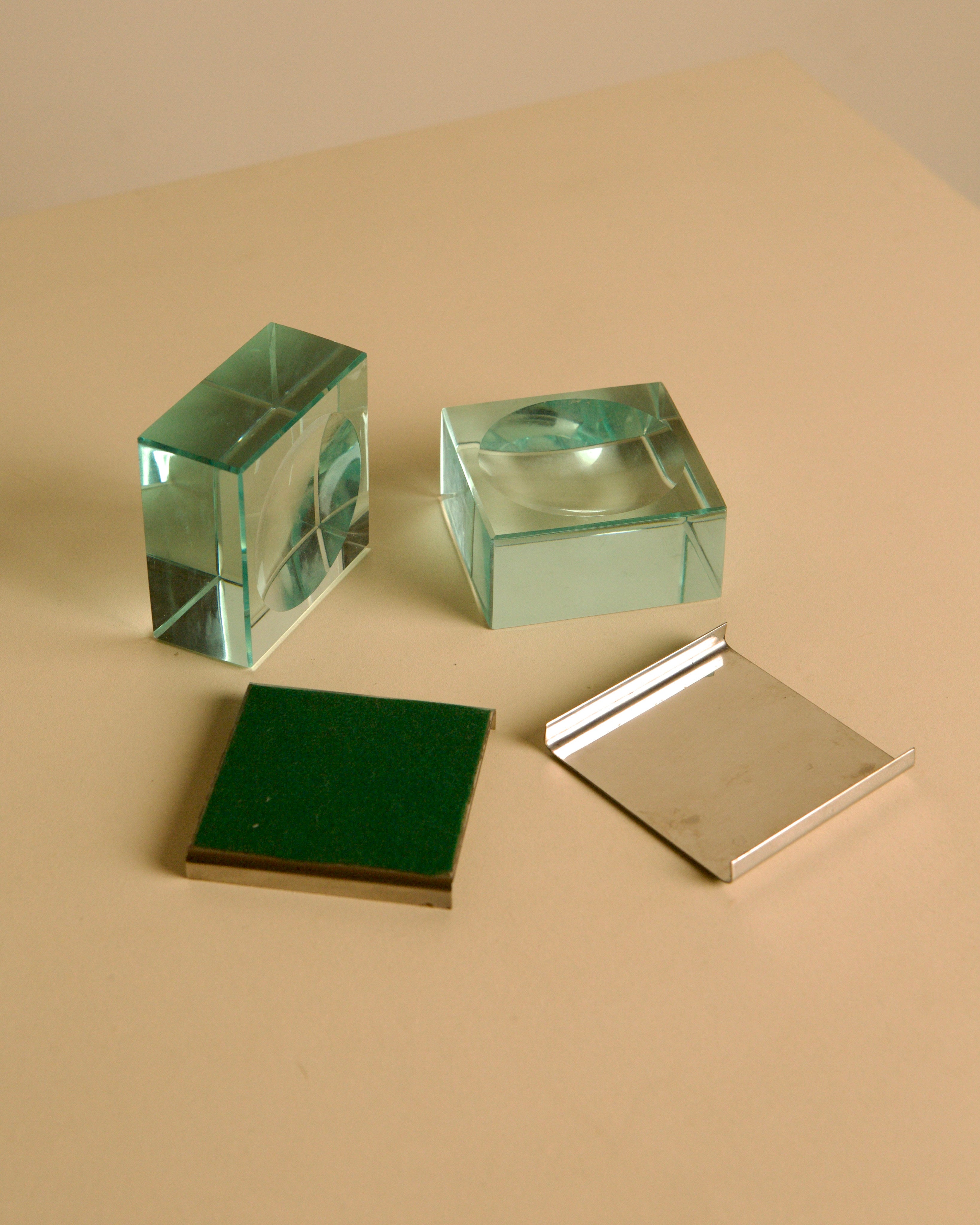 Pair of glass and metal ashtrays by Fontana Arte, 1960s — close-up