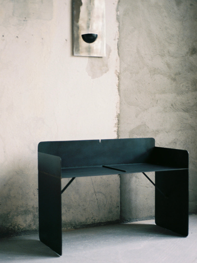 The Bench - Brutalist Bench in Steel — close-up of black steel surface