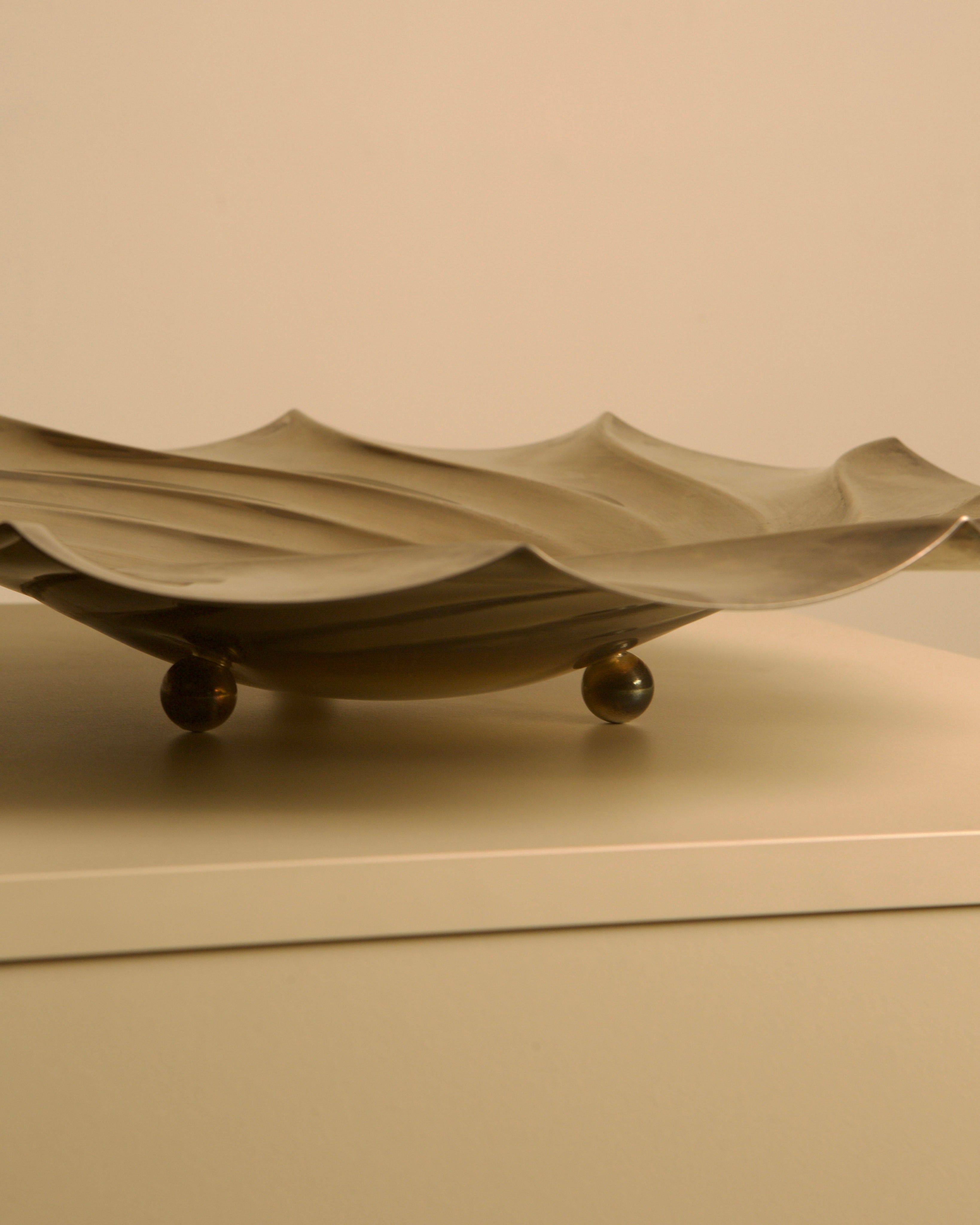Large Italian Silver-plated Metal Vide-poches — side angle showing curved design and feet