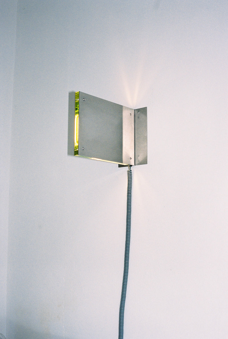 Flat Light Brushed wall lamp in brushed steel with cord by Amber Dewaele