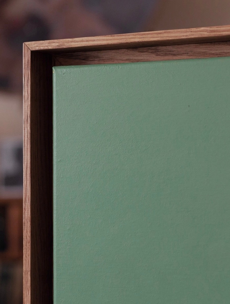 Beneath' Painting — corner view with wooden frame and green canvas