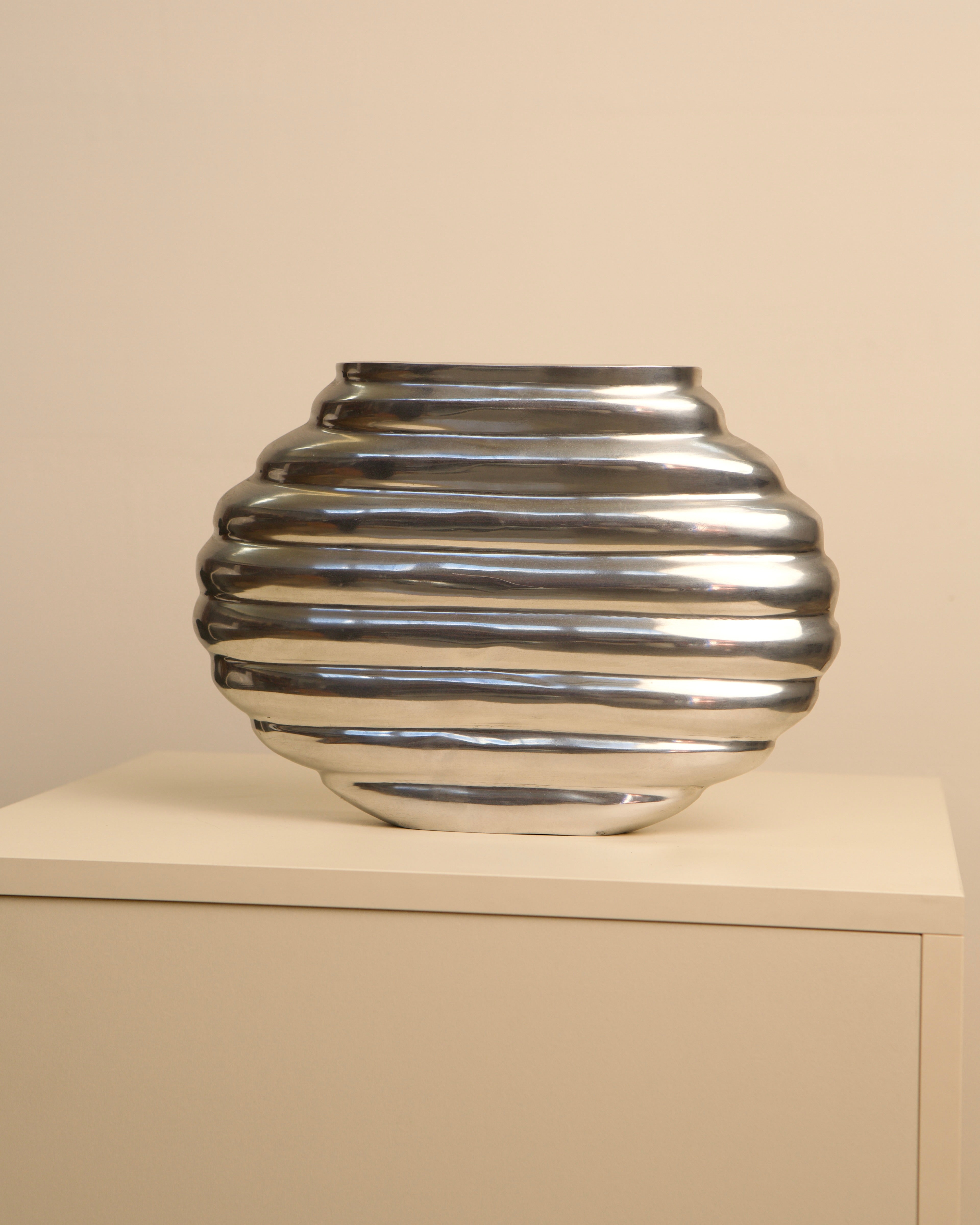 Ribbed cast aluminum vase with spherical form from the 1980s