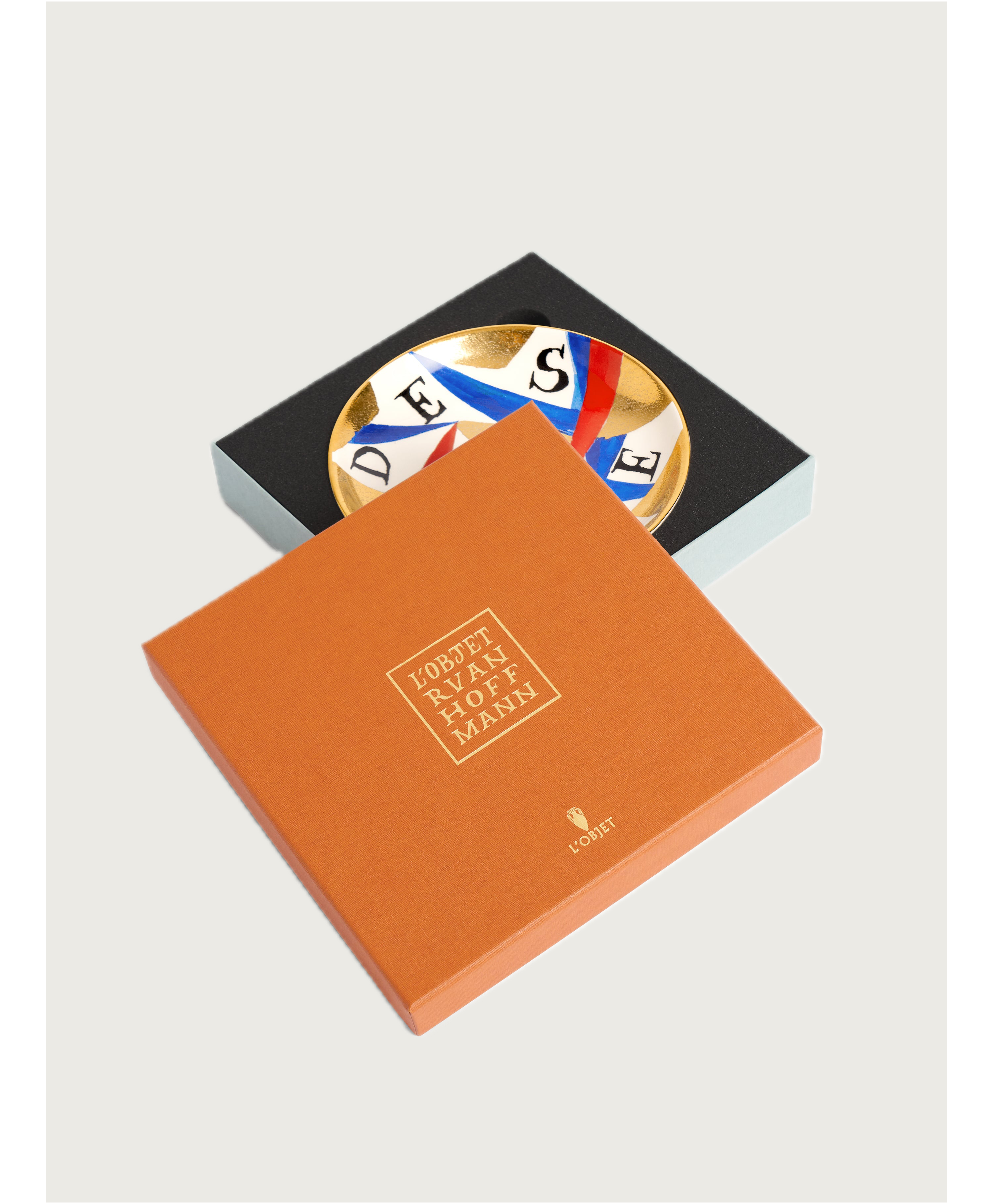 Ruan Hoffmann Desire Plate — displayed in designer packaging with colorful design