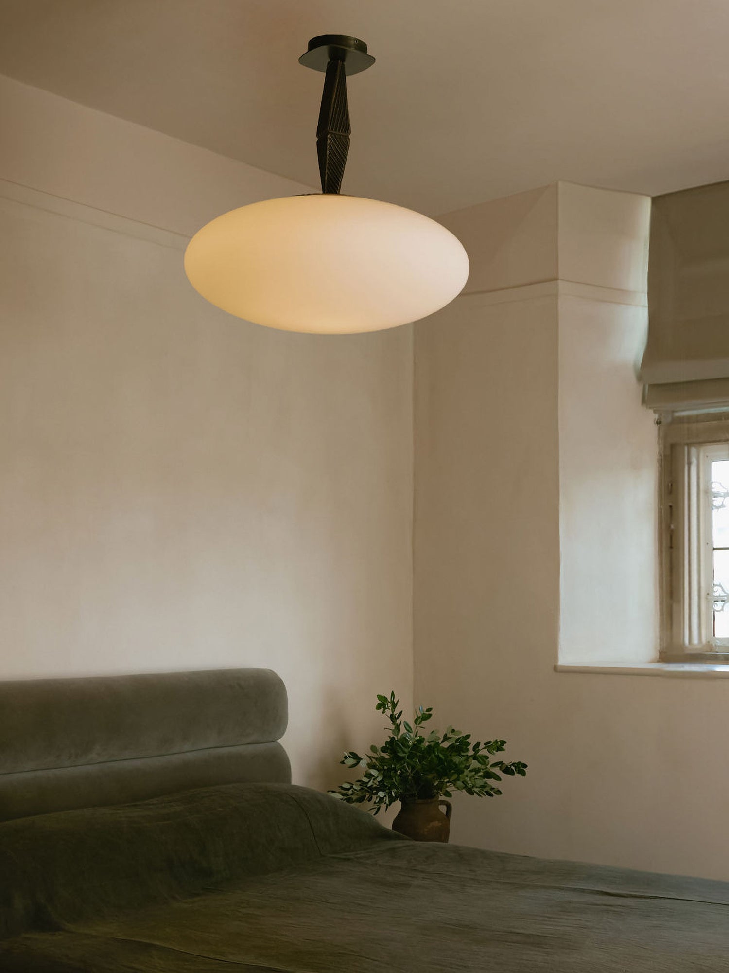 JULES Pendant with Opal Glass — hanging in softly lit bedroom setting