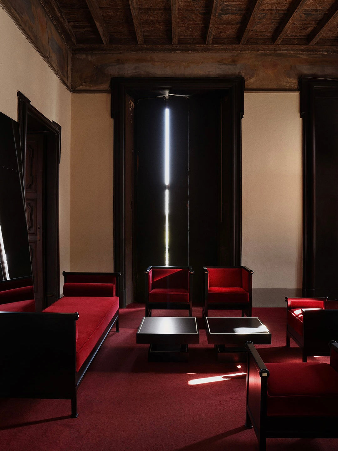 Keys Daybed — side angle in modern red and black setting
