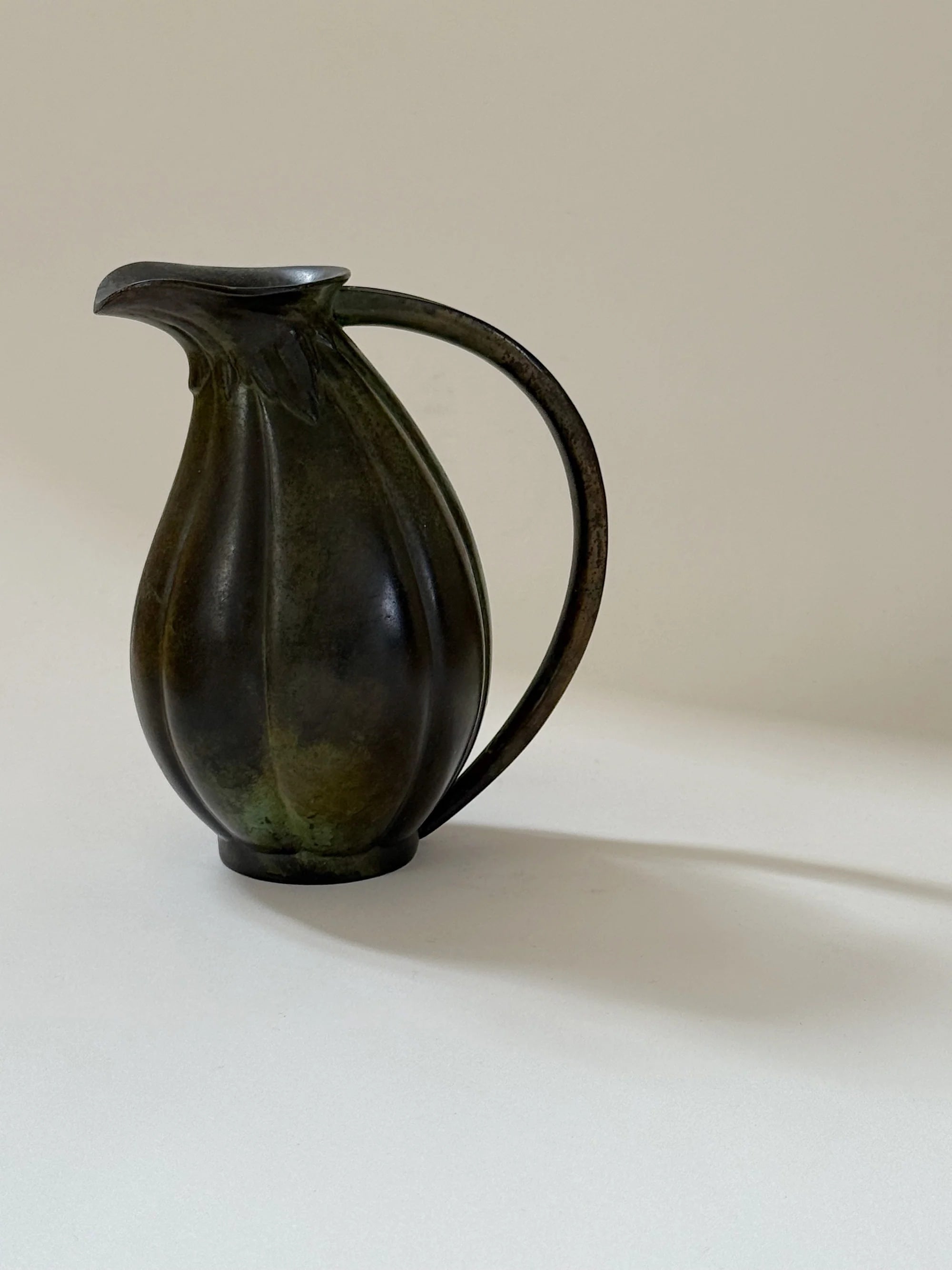 Danish Bronze Vase with Ribbed Form, 1910s — angled view on neutral background