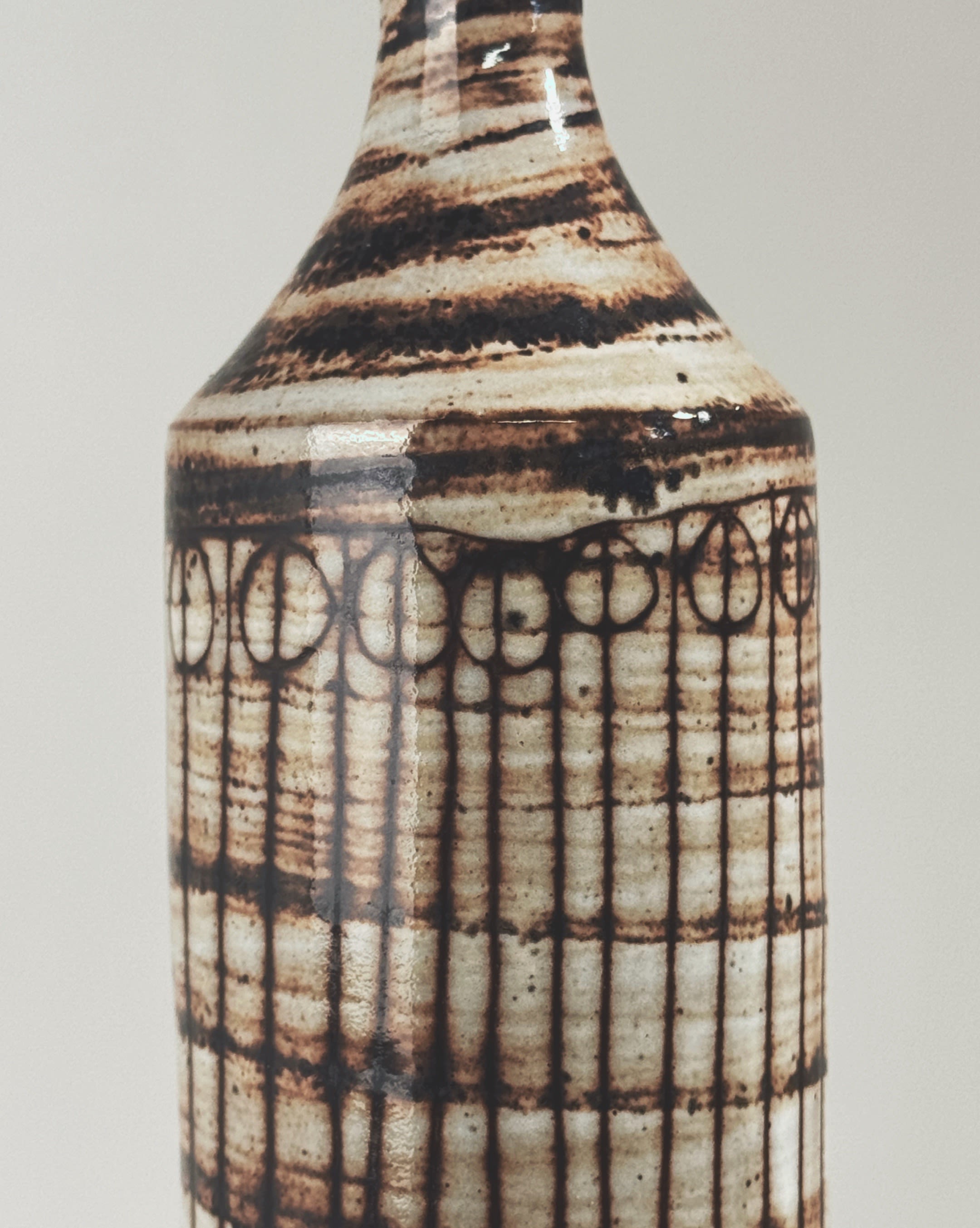 Striped ceramic vase detail showing geometric pattern by Pouchain