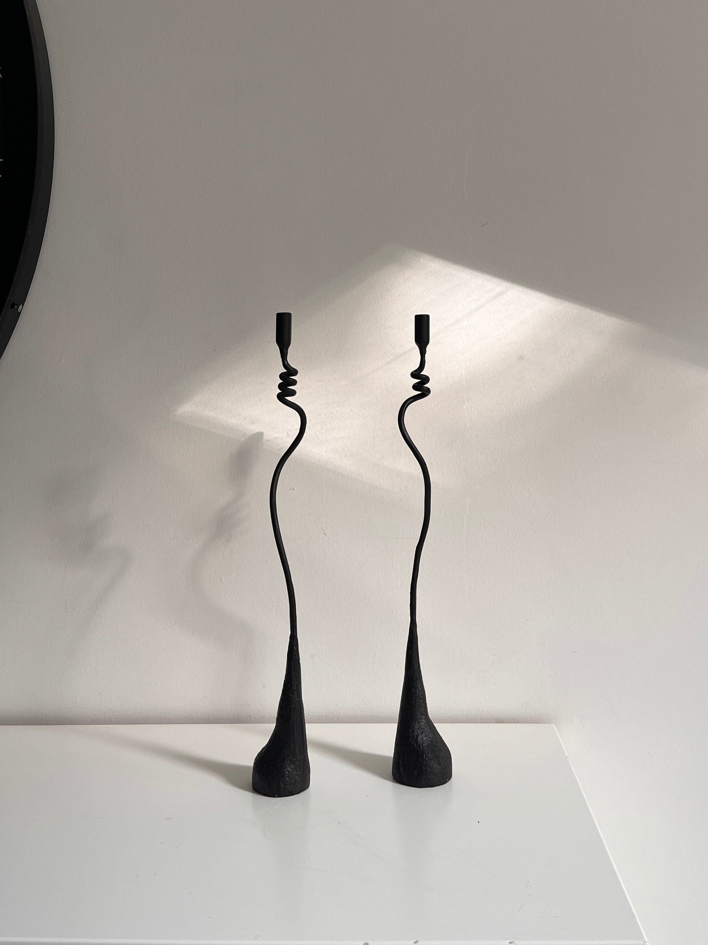 Jasmine Candleholders — top view of black metal design on white surface