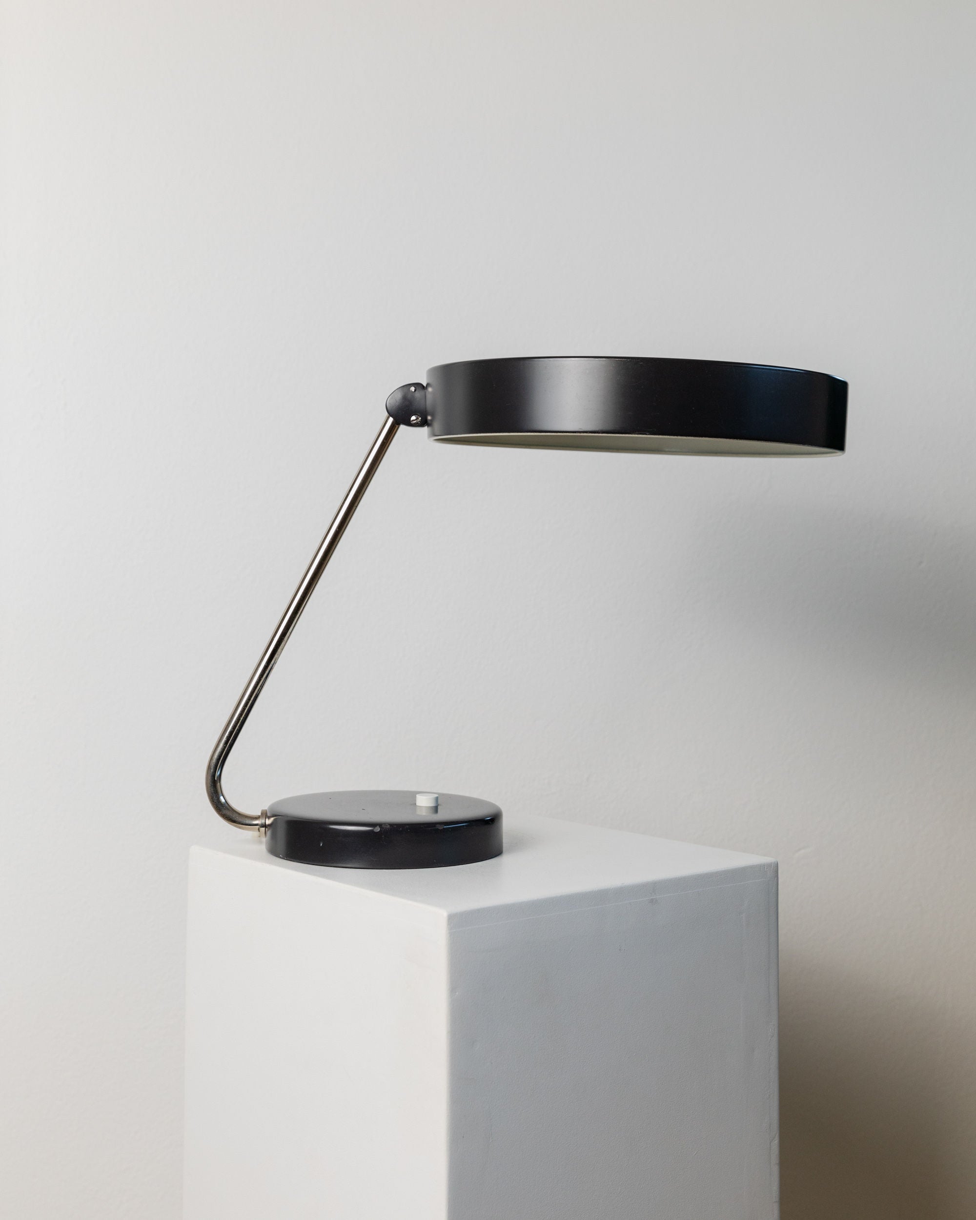 Table Lamp by Kaiser Idell, 1960s — close-up of black metal shade and arm