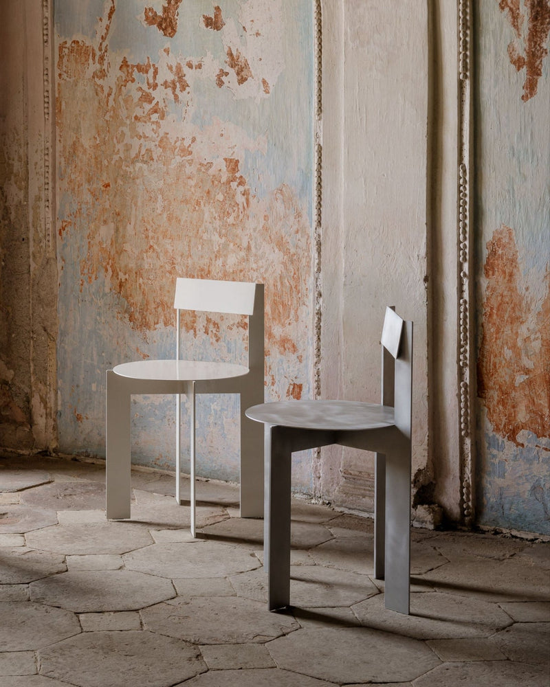 Aluminum Chair Object111 — angled view against textured wall