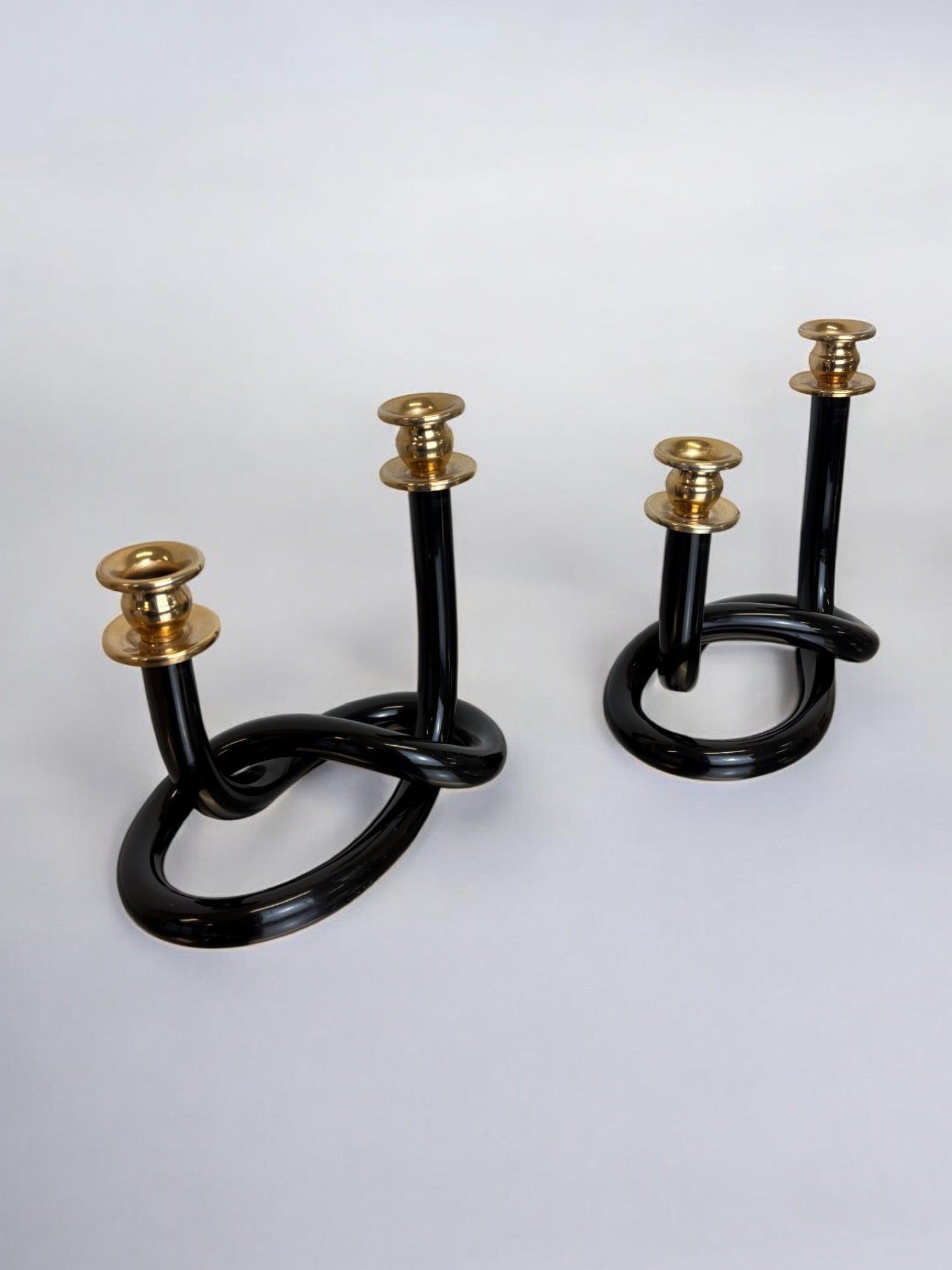 Pair of Black Candleholders by Dorothy Thorpe, 1970s — angled view on neutral background