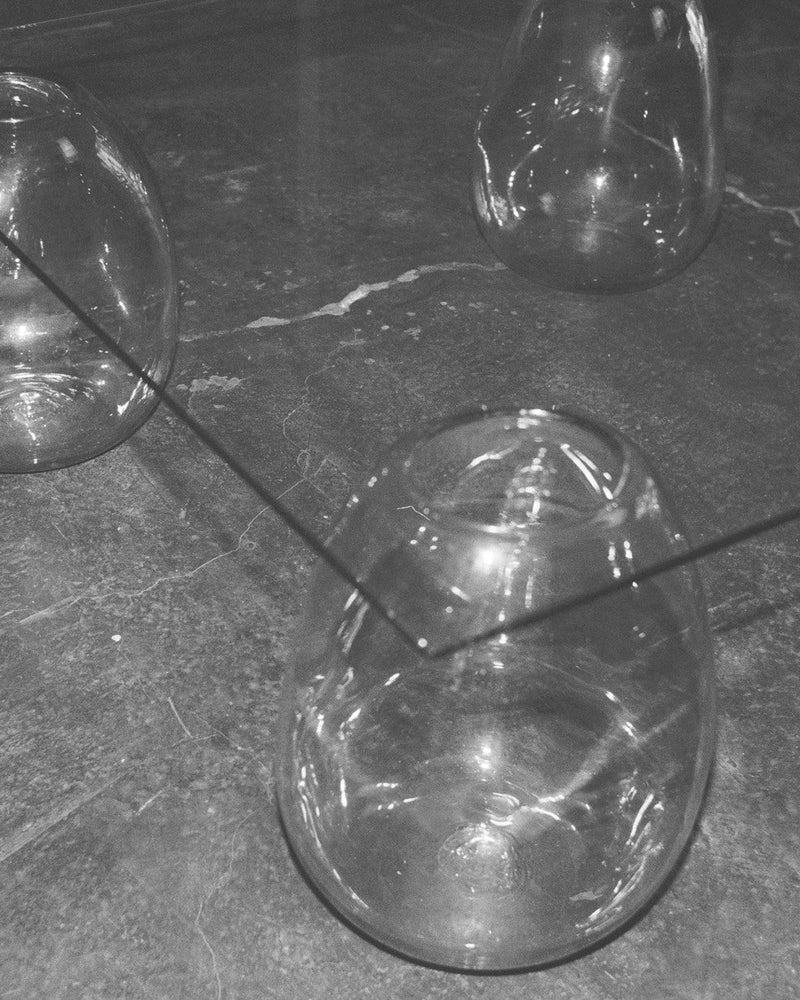 Transparent bubble glass coffee table detail view on concrete floor