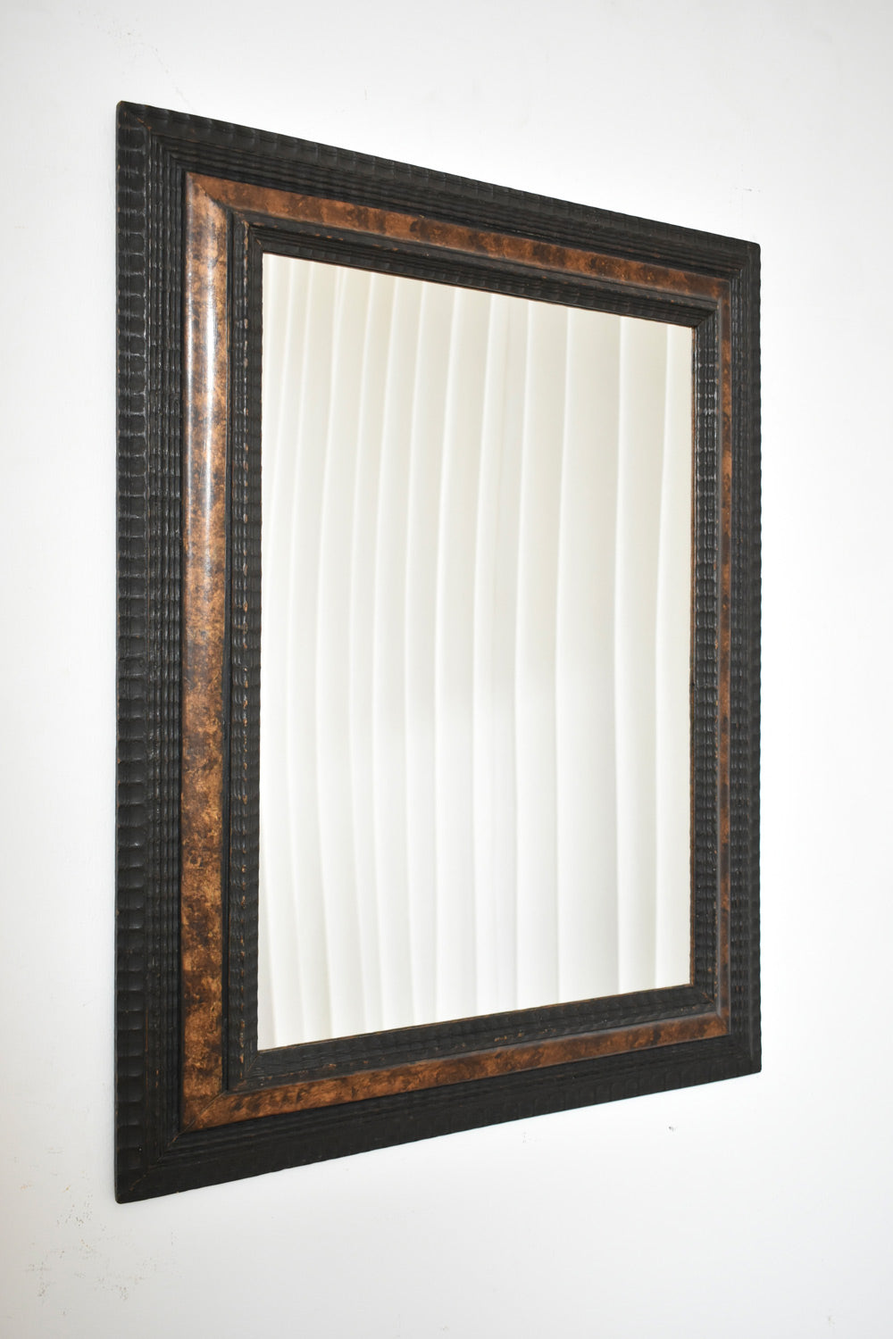 Carved ebonised wood mirror and trompe l'oeil turshell, XIXth c. by Barracuda Interiors | The Oblist