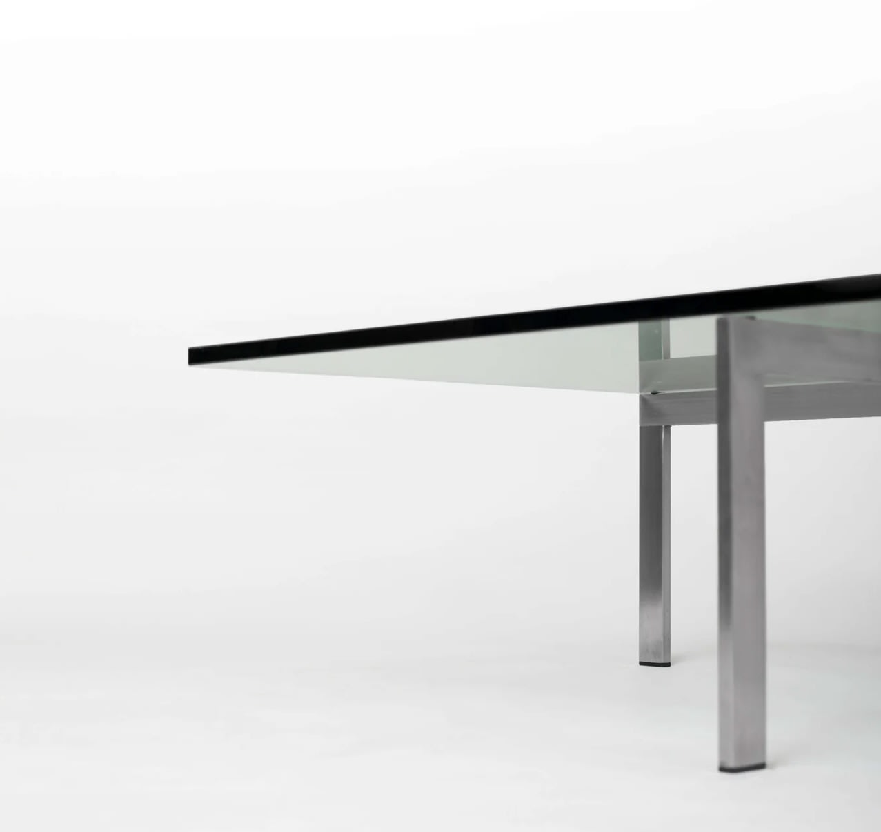 KW1 glass, metal and granite coffee table by Hank Kwint for Metaform 1980s — side angle showing glass top and metal legs