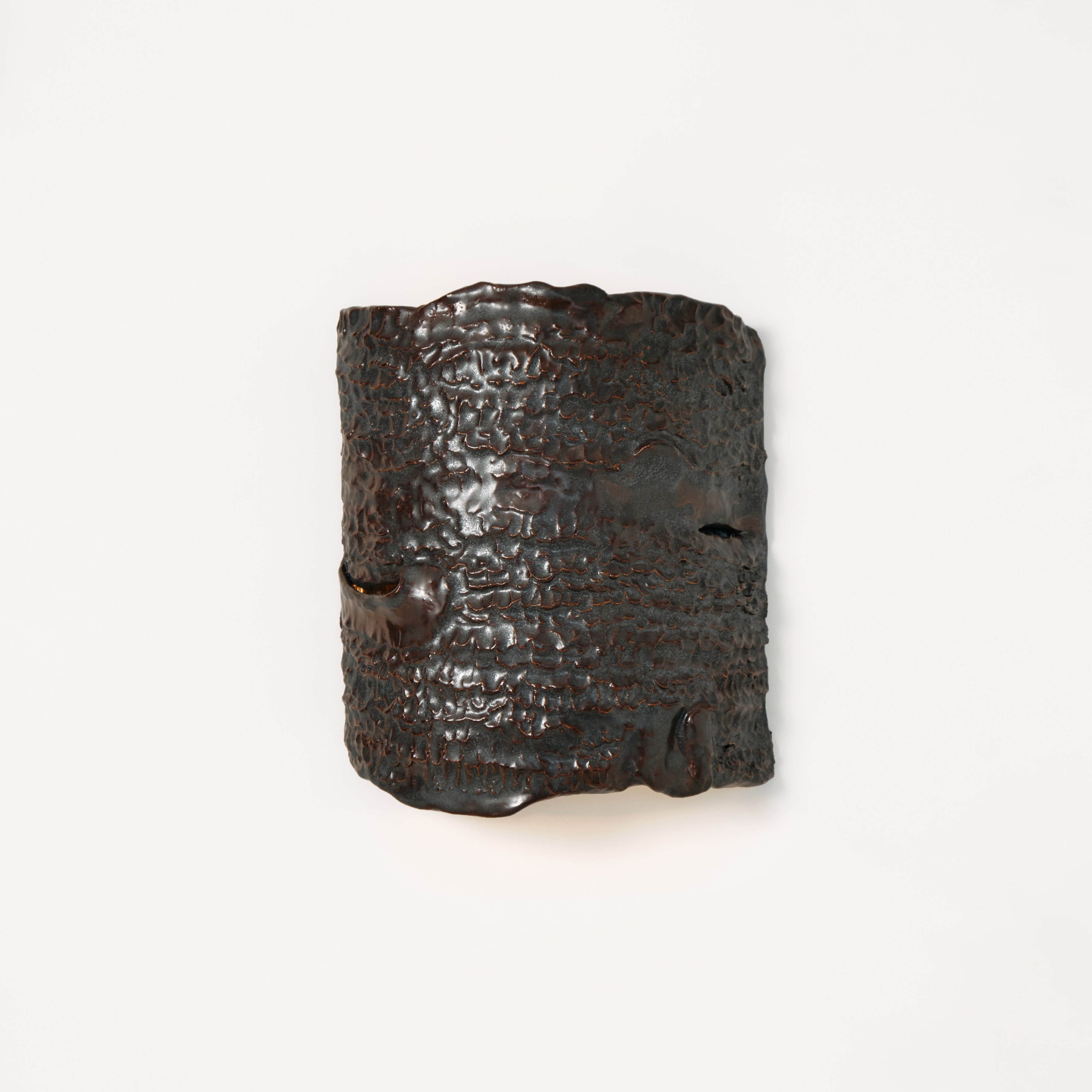 Casa Wall Light No3 — top view of textured dark metal surface