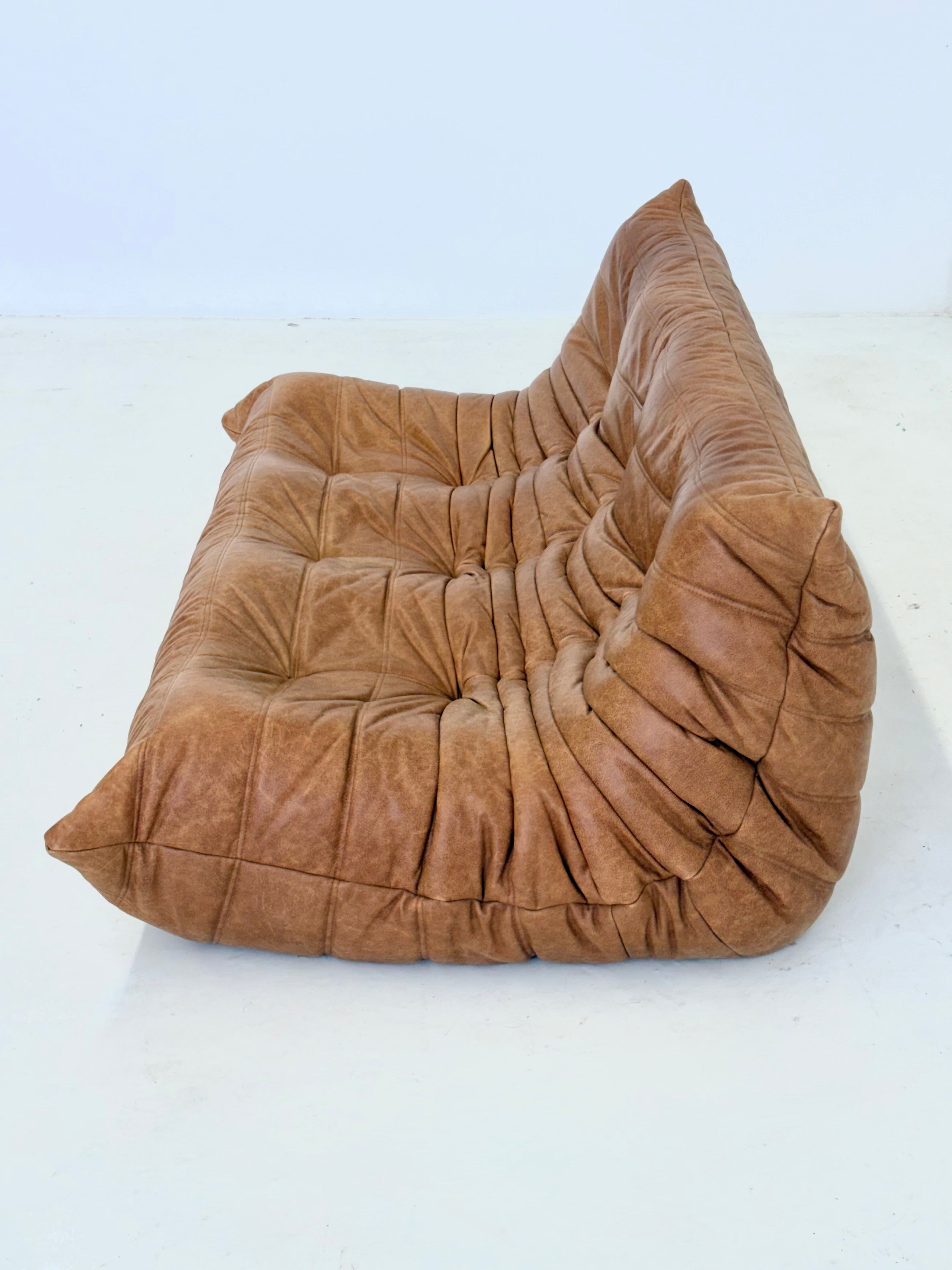Ligne Roset Togo 3-seater in cognac leather — lifestyle setting