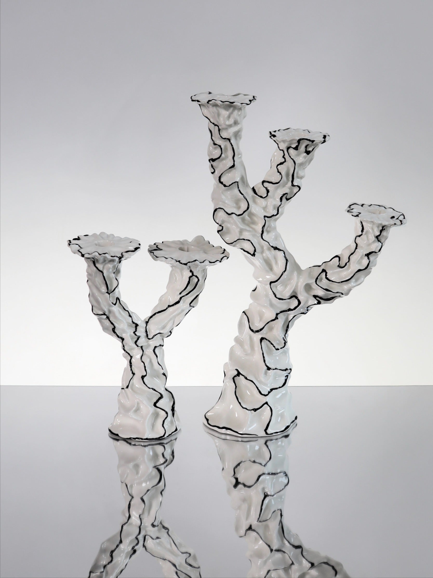Two Wishes Candle Holder — angled view on reflective surface