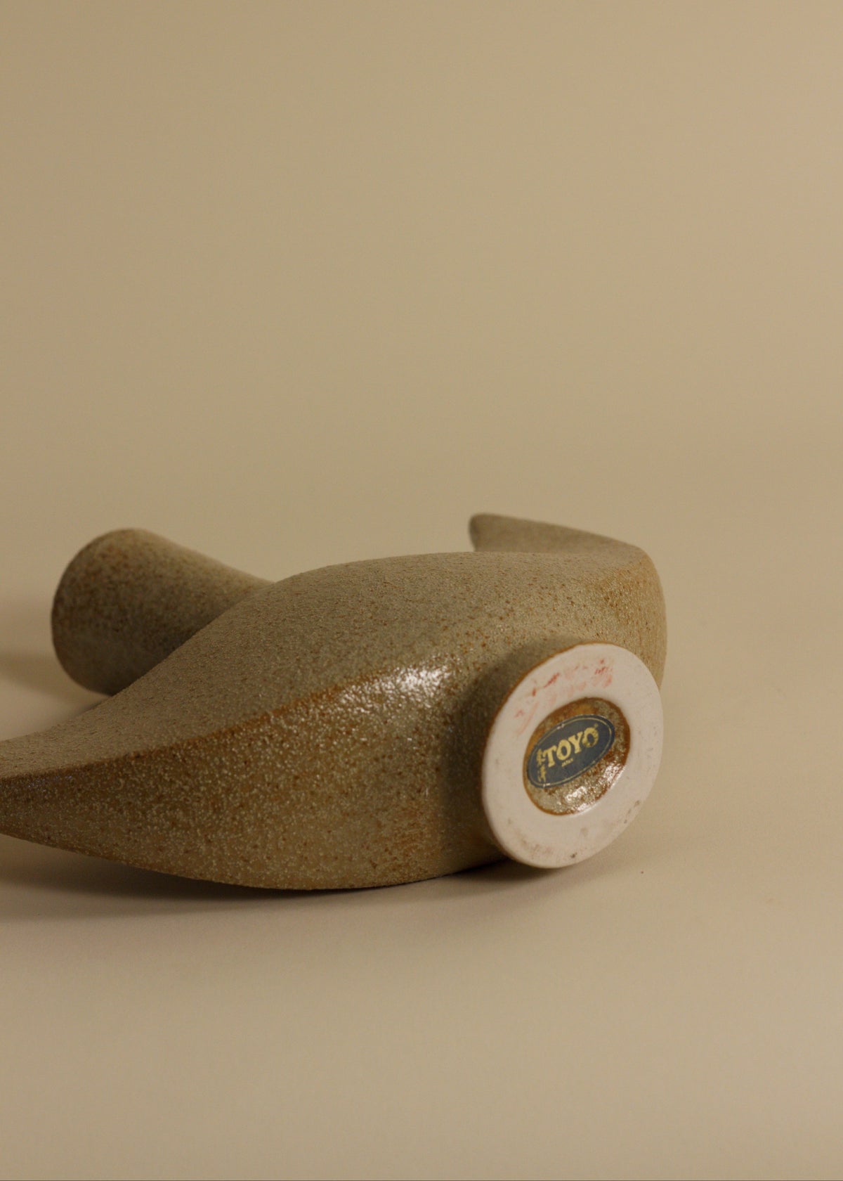 Sculptural Ceramic Vase by Toyo – Crescent Form with Original Label — close-up