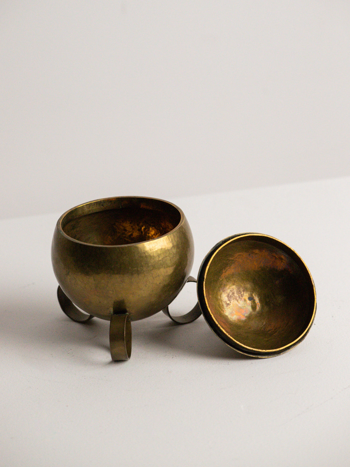 Hand Raised Brass Sphere Box with Toothed Zigzag Finial, Art Deco Style, Central European Workshop, circa 1930s — lifestyle setting