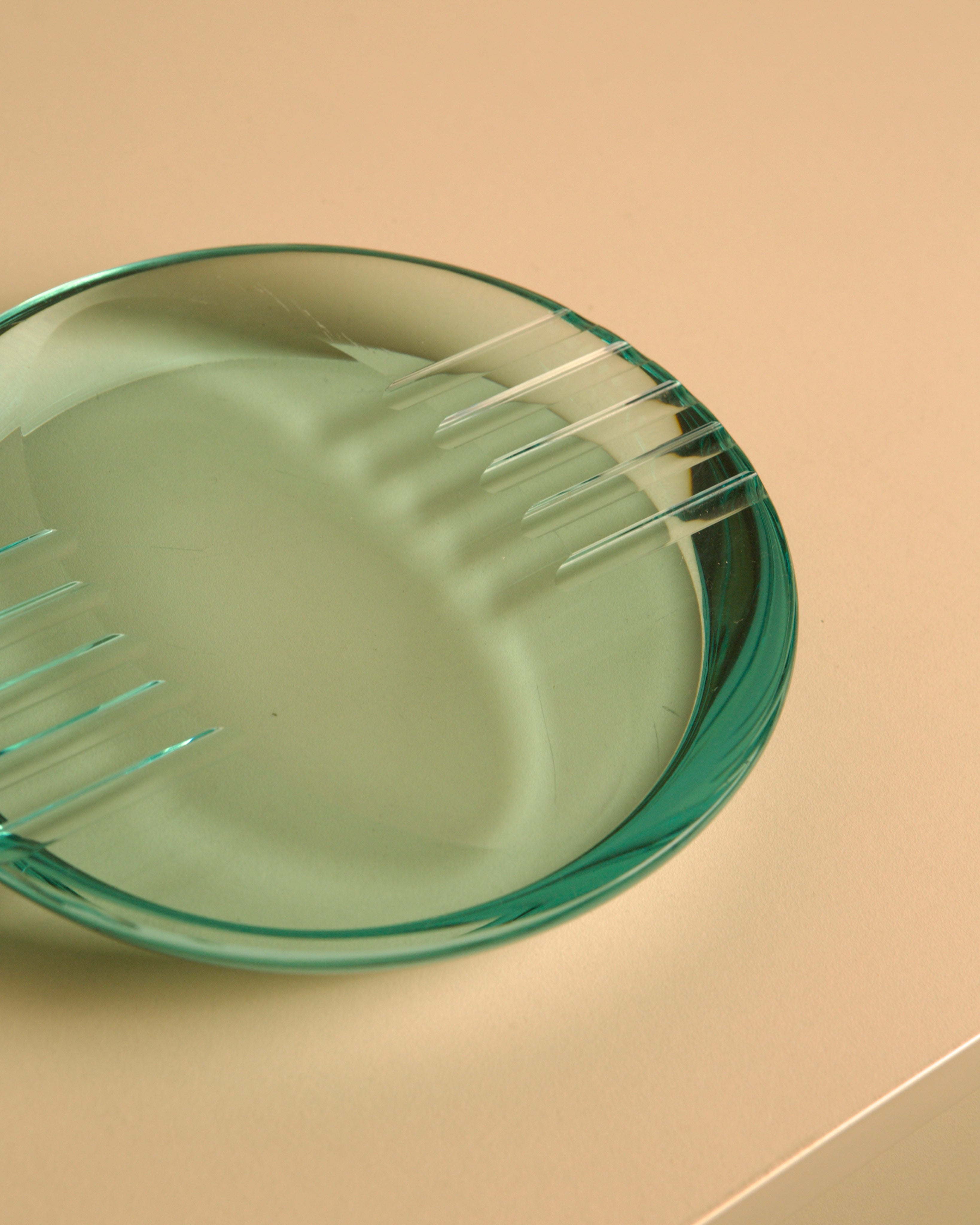 Round Italian Glass Ashtray by Fontana Arte, 1970s — side angle showing translucent green glass