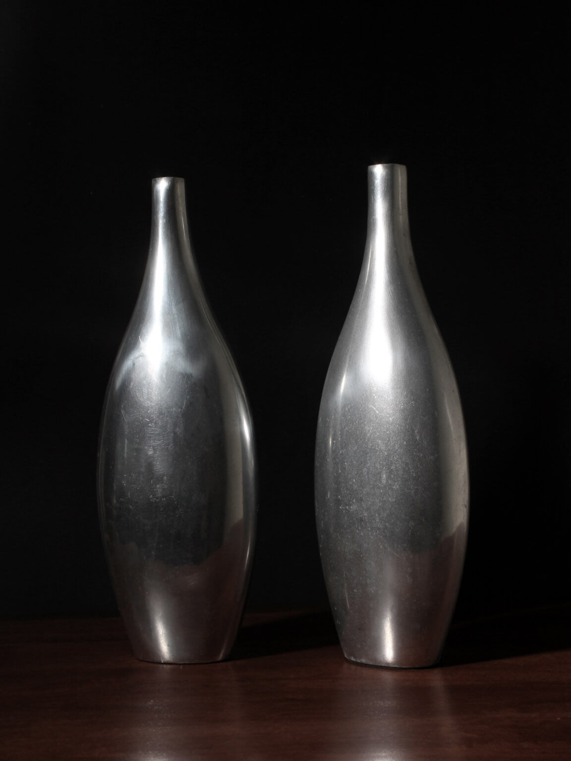 Pair Of Polished Aluminum Tall Vases — detail view