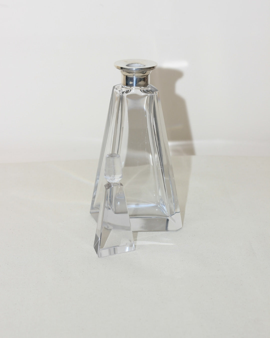 Art Deco Decanter — side angle showing clear glass and silver stopper