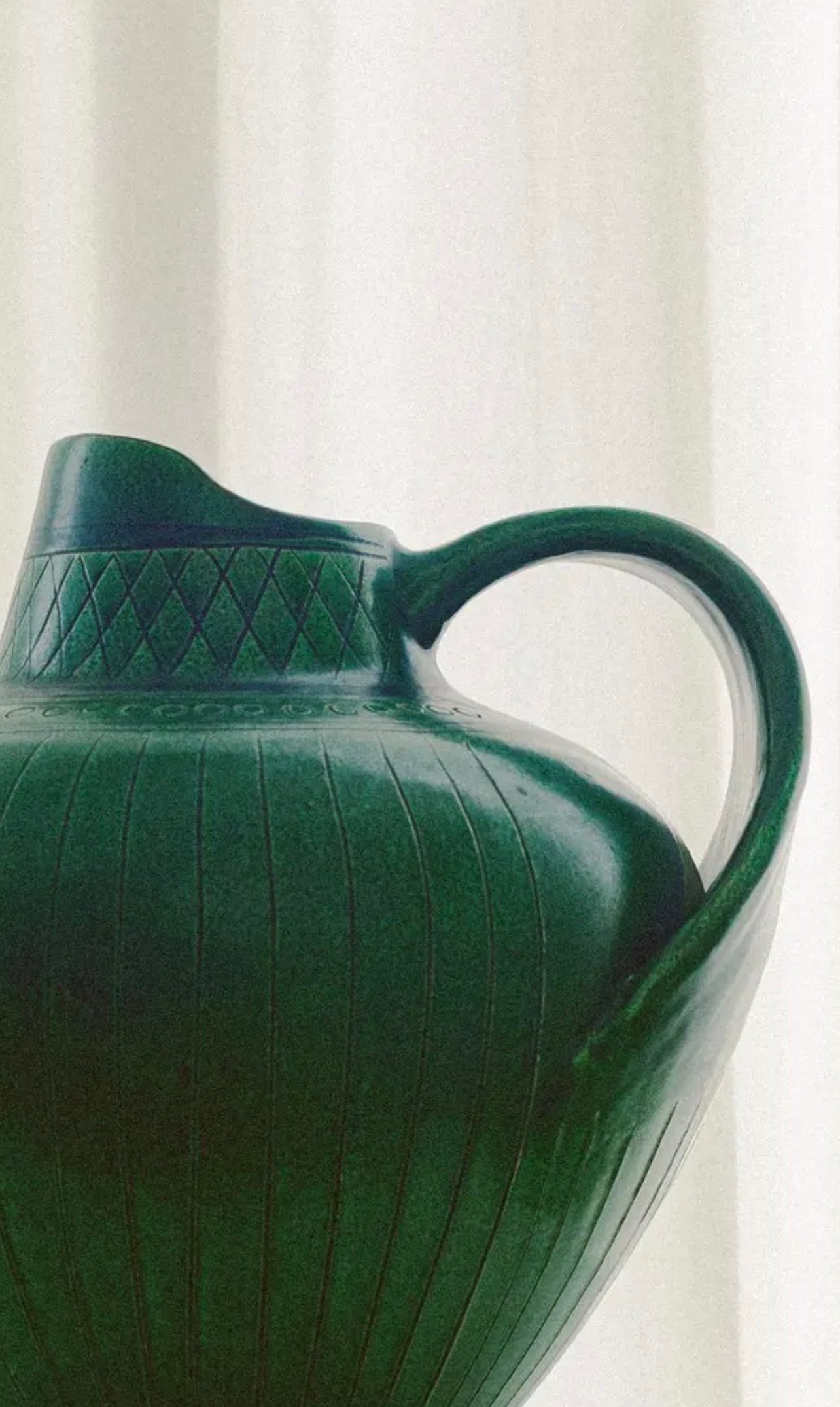 Wilhelm Kågel Hand-Thrown Ceramic Pitcher — close-up of green ceramic surface