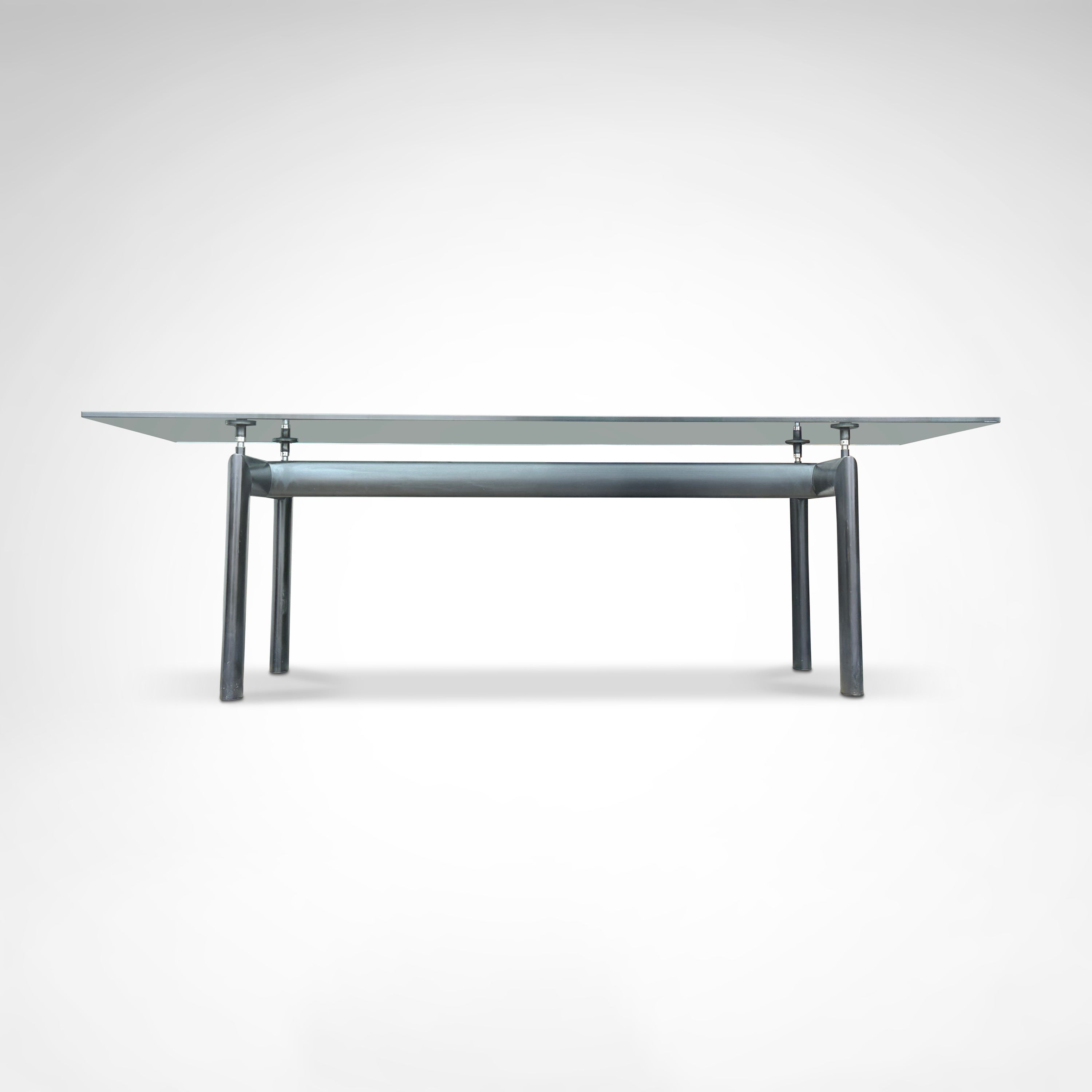 LC6 Dining Table by Le Corbusier et al. for Cassina 1990s — side angle showing glass top and metal legs