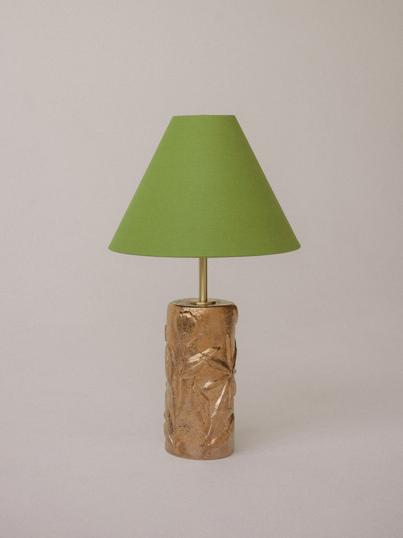 Gold ceramic table lamp with textured botanical base and lime green shade