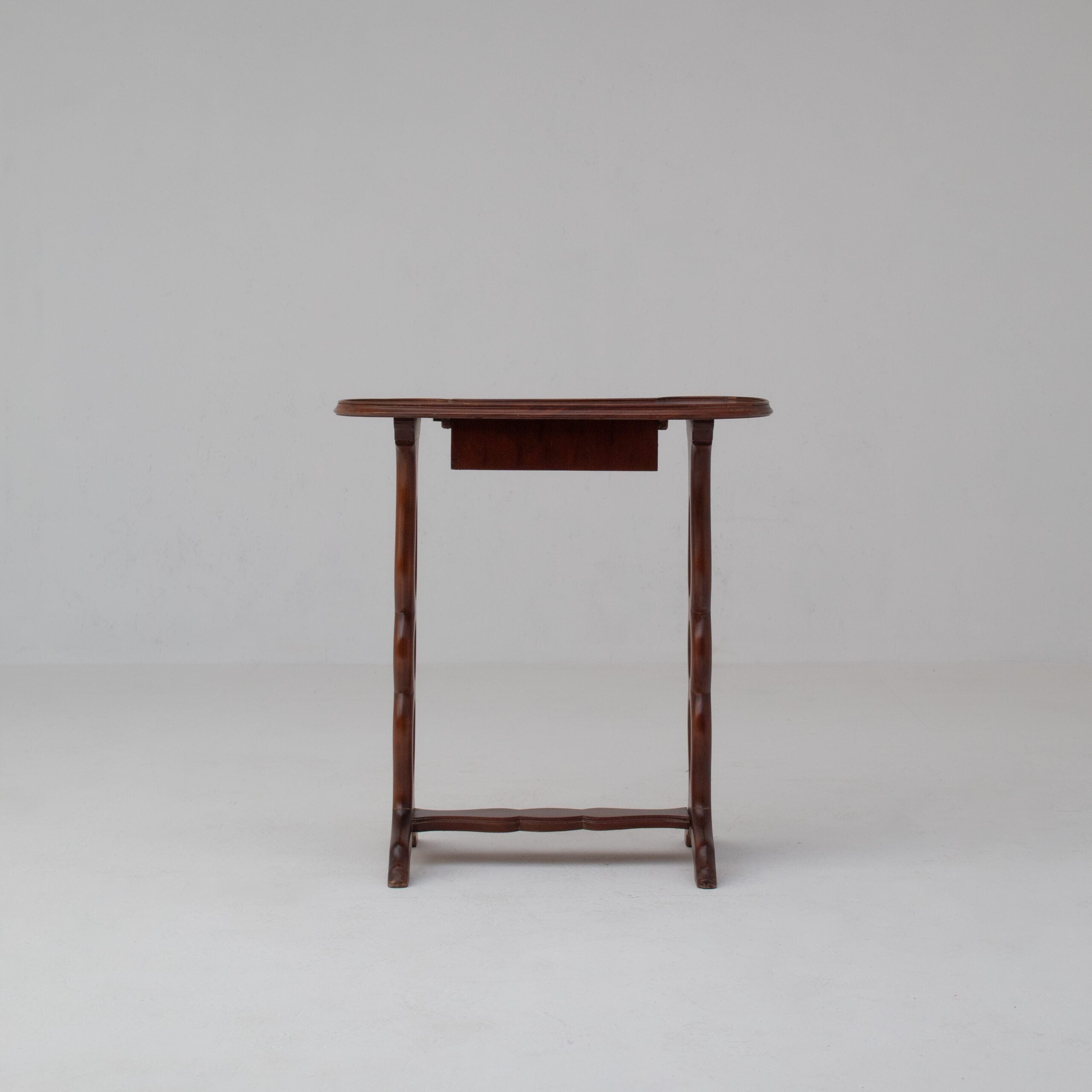 Michel Briard Sculptural Mahogany Side Table with Drawer — lifestyle setting