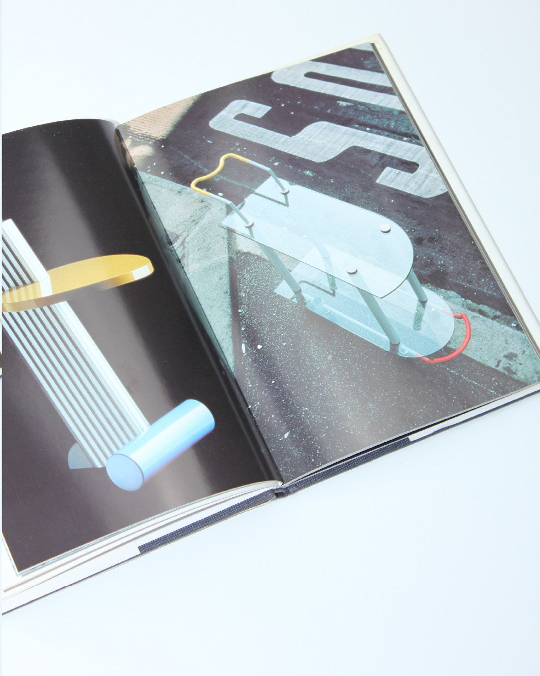 Memphis — open book showing colorful geometric illustrations
