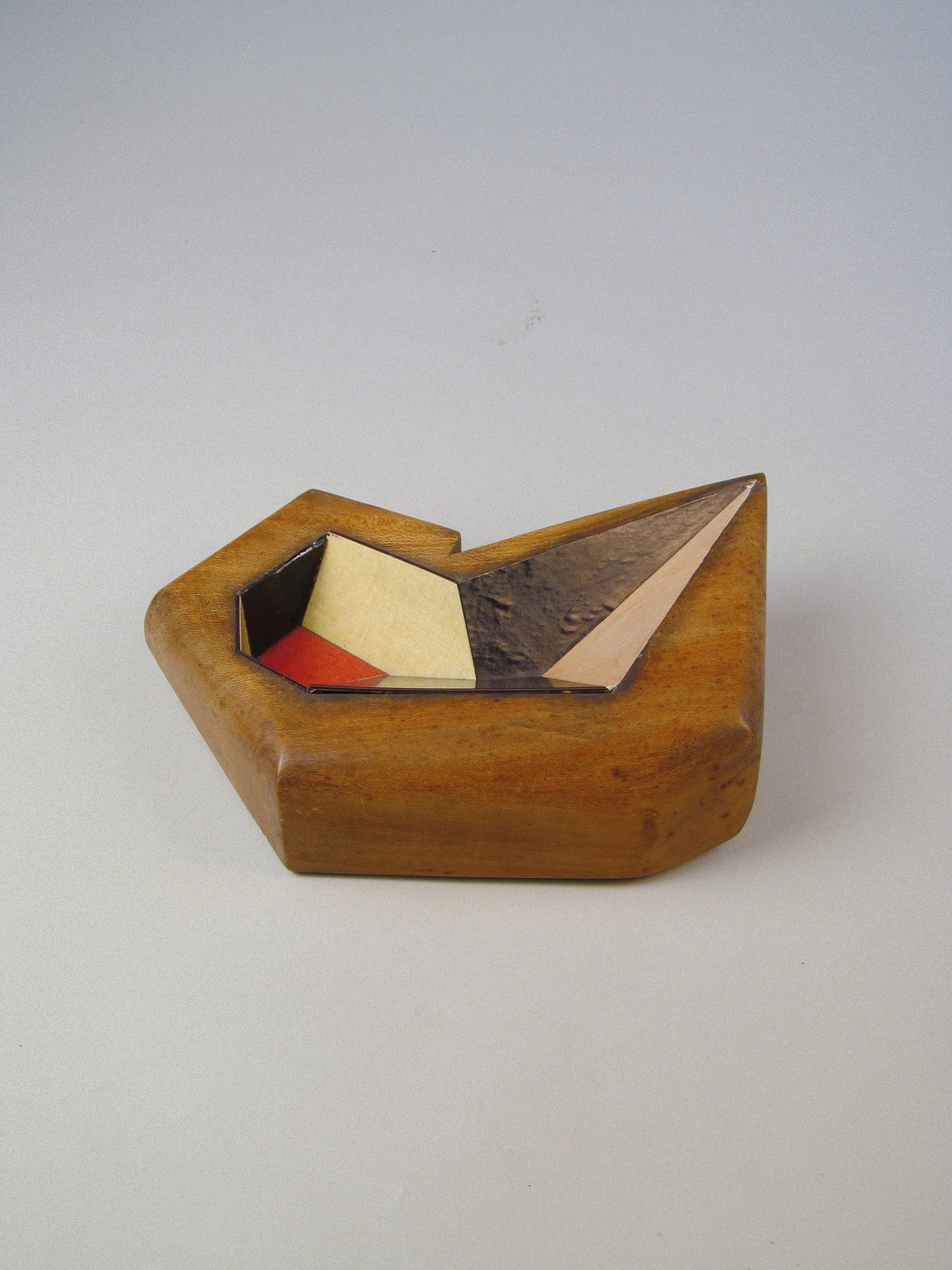 Cubist Vide Poche — side angle showing wooden base and colorful inlay