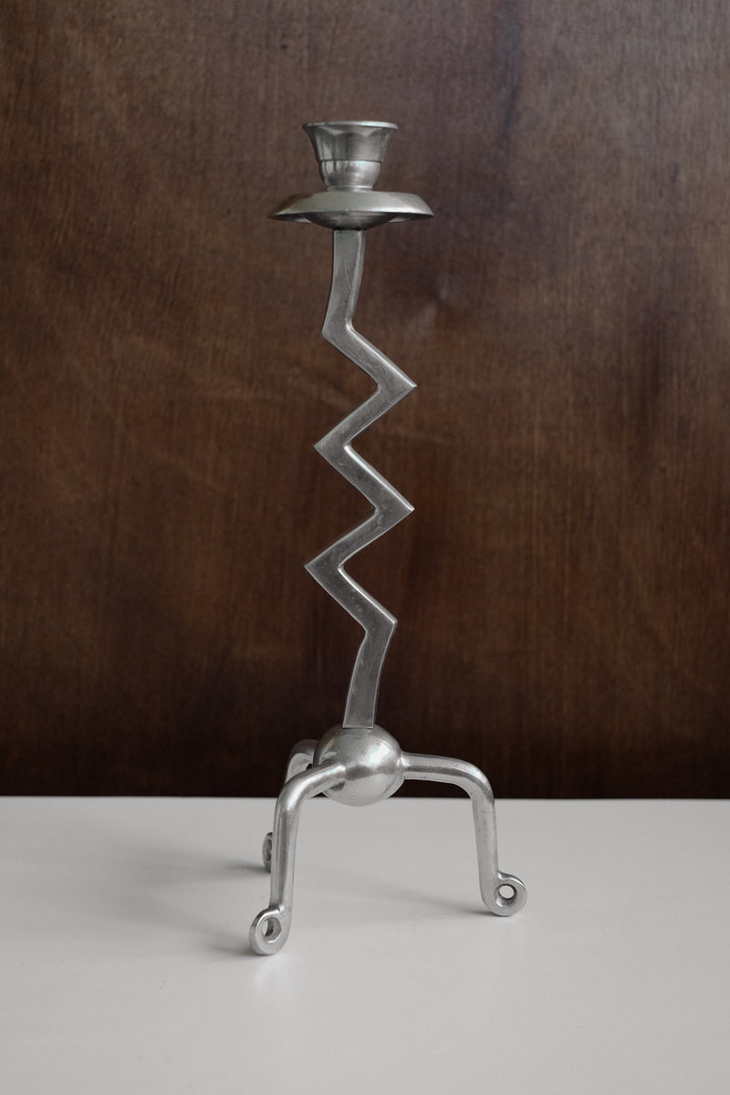 Zigzag Candleholder — close-up of silver metal design on white surface