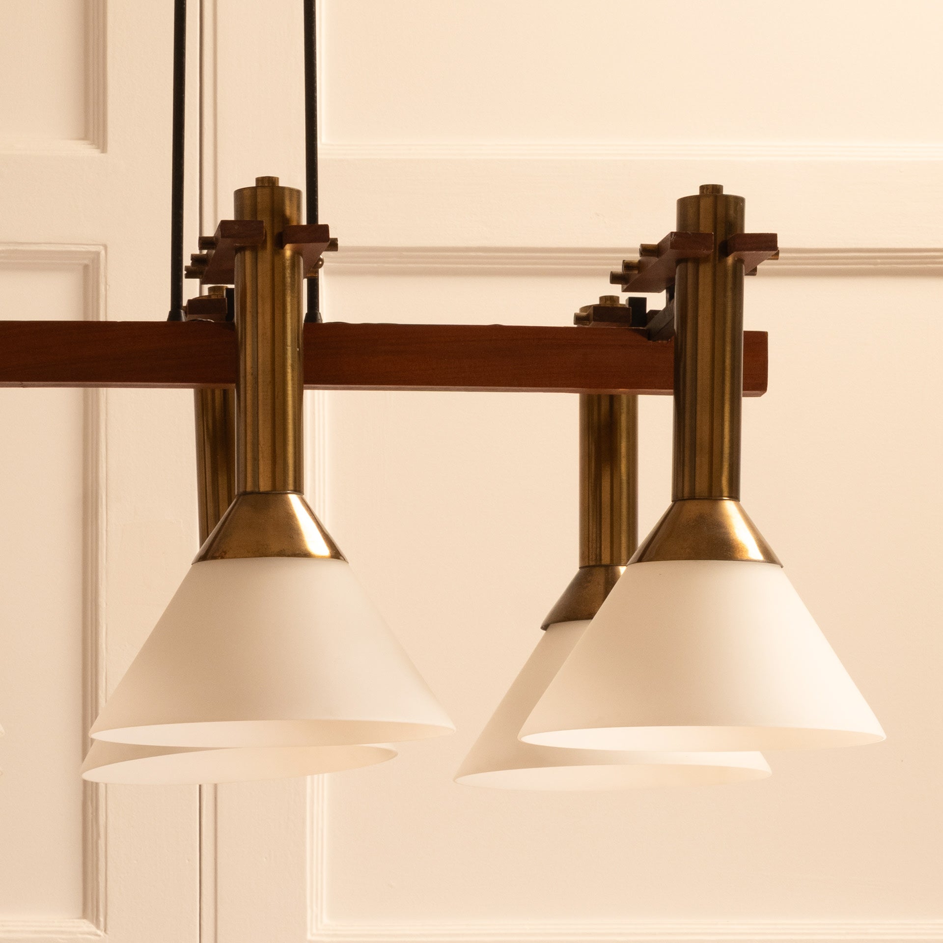 Six-light pendant lamp — top view of brass and glass shades